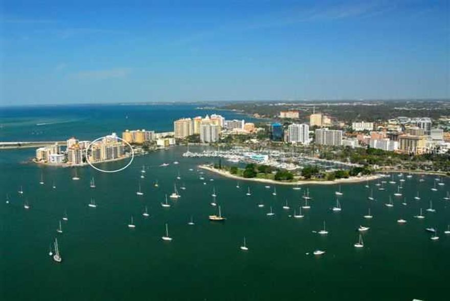 DRAMATIC PRICE REDUCTION OF $800,000 ON 9/13. BY LAND OR BY SEA! With 455' of shoreline, deeded 65' dock on deep water, there is easy access to Sarasota Bay and the Gulf of Mexico. A masterpiece of design and proportion, the 5,585 sq. ft. residence offersan extensive Master suite with refined appointments, his/her retreats, 3 guest suites, media room, wine cellar, summer kitchen with gas grill, along with an extraordinary kitchen design, elite appliances, rare onyx and granite surfaces. Outstanding amenities include a concierge staff that anticipates your every need in this pet-friendly environment.  La Bellasara expresses a gracious interpretation of the art of living well. The penthouse, originally chosen by the developer, is finished to perfection with exquisite materials and fixtures. Embraced by the most exciting views of city lights, and the unpredictable wonder of sunrise and sunset, the location on Golden Gate Point  is readily accessible to the  riches of the arts district as well as the splendid beaches and bays.