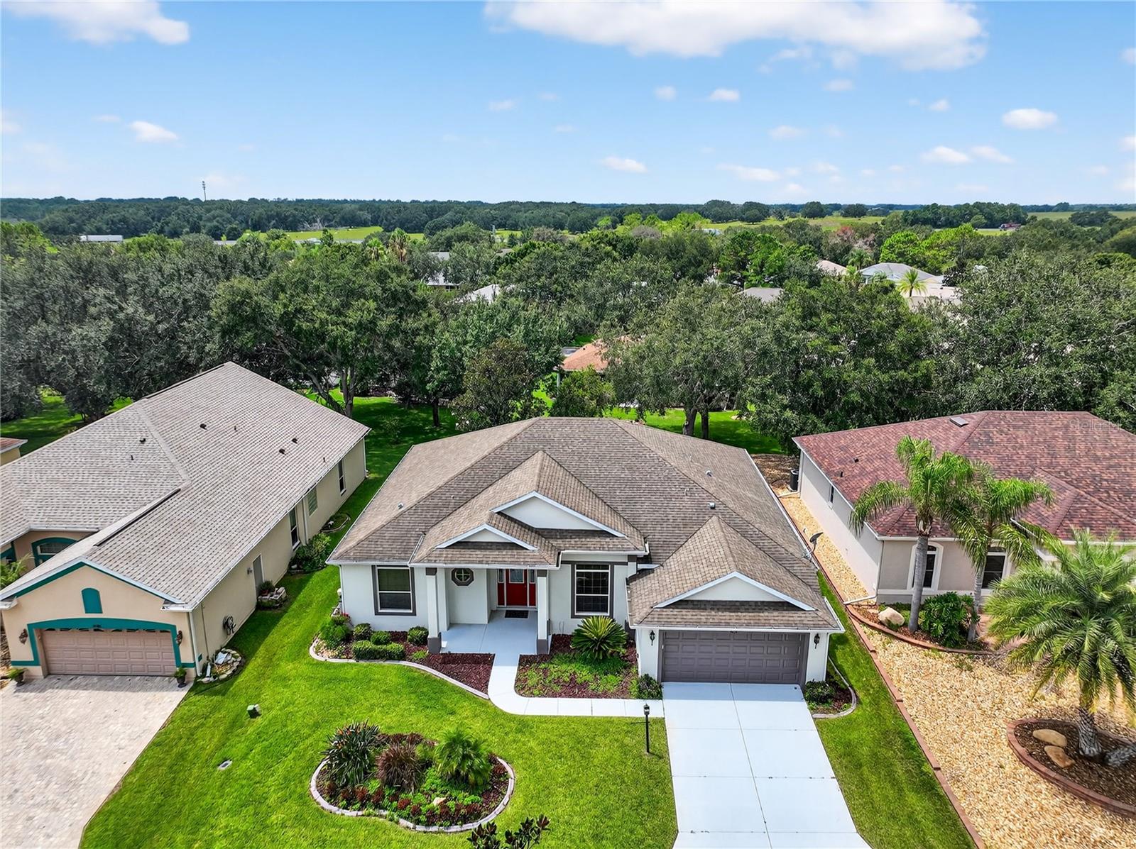 LIVE WHERE YOU PLAY - Golf Clubs and more at Plantation at Leesburg ! Welcome to Your Dream Home in The Plantation at Leesburg – Nottoway Village!
This beautifully appointed 3-bedroom, 2.5-bath home is a rare find, offering two luxurious primary suites, each with its own en suite bath, plus a spacious guest room and convenient half bath.
Step inside and you’ll be greeted by an inviting living and dining area with elegant crown molding, gleaming wood laminate floors, and sliders that lead to the oversized screened lanai. Perfect for entertaining or quiet mornings with a cup of coffee, the lanai overlooks a serene, park-like backyard.
The updated kitchen is a chef’s delight, featuring custom wood cabinets, granite countertops, stainless steel appliances, granite sink, stylish backsplash, ample pantry, and even a built-in desk. The adjoining family room also opens to the lanai, making indoor-outdoor living a breeze.
Both primary suites are spacious retreats with wood laminate flooring, walk-in closets, and spa-inspired baths boasting granite counters, dual vanities, walk-in showers, and even a garden soaking tub in the main suite. The third bedroom is generously sized at 12x12—ideal for guests, hobbies, or a home office.
The laundry room is thoughtfully designed with a sink, storage cabinets, and washer/dryer included.
Resort-Style Living Every Day
in The Plantation at Leesburg means more than just a home—it’s a lifestyle! Enjoy 2 championship golf courses, 3 clubhouses with pools and spas, 2 fitness centers, tennis, pickleball, bocce ball, horseshoes, archery, a woodworking shop, walking trails, softball field, on-site restaurant & bar, pro shop, and over 100 clubs and social activities on the calendar.
Prime Location
Conveniently located just 10 minutes from Downtown Leesburg’s restaurants, shops, and entertainment, with easy access to nearby lakes and parks. And when it’s time for a little magic, you’re less than an hour from Disney, Universal, and SeaWorld!