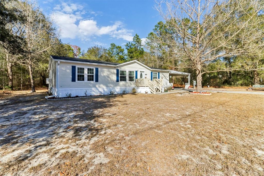 Photo of 16180 NE 2nd Loop, Silver Springs, FL 34488 (MLS # O6381764)