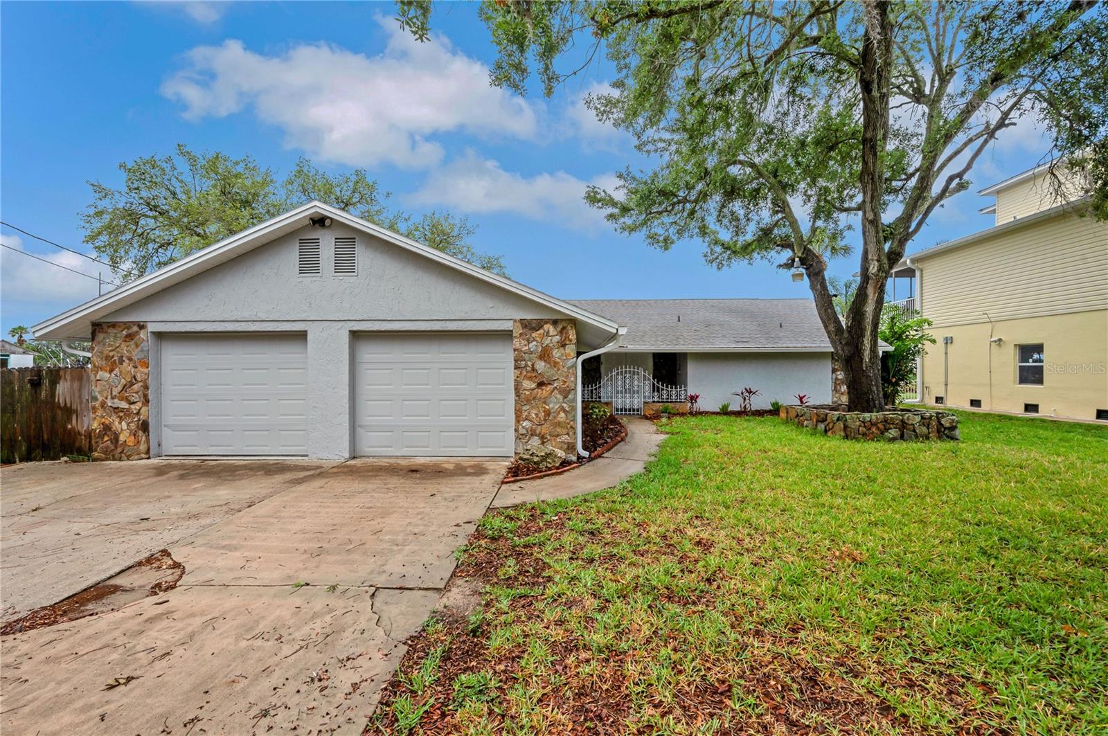 ****ATTENTION BUYERS!!!!****Our Seller is offering up to 2% closing cost assistance to buy down rate and a free appraisal credit up to $750. Your waterfront escape is calling! Tucked away on a generous canal-front lot with 150 feet of water frontage, this home is all about living the Florida lifestyle without limits—no bridges, no HOA, and direct Gulf access right from your backyard. Whether you’re docking your boat, casting a line at sunset, or pulling up with the RV after a weekend adventure, this property gives you the freedom to do it all. Inside, natural light pours into an open-concept layout where the kitchen gleams with granite counters and stainless steel appliances, and fresh paint and new flooring tie everything together with a modern touch. The owner’s suite is its own private retreat, with sliding doors to the backyard, a walk-in closet, and a spa-like bathroom that feels brand new. A 2024 roof means peace of mind, and the screened-in patio means year-round enjoyment with waterfront views as your backdrop. Just minutes away, you’ll find sandy Hudson Beach, local restaurants like Sam’s Beach Bar, and the laid-back coastal charm this area is known for. Easy access to Hwy 19 and the Suncoast Parkway keeps Tampa and the airports within reach, but once you’re here, you’ll never want to leave. Affordable Gulf-front living is rare—especially with no bridges and no HOA. This is the one you’ve been waiting for.