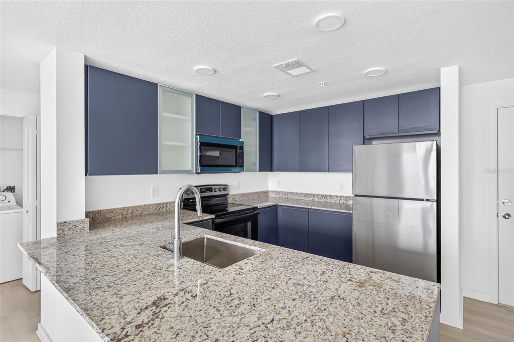 Photo of 5563 Millenia Park Blvd #415, Orlando, FL 32839 (MLS # O6445896)