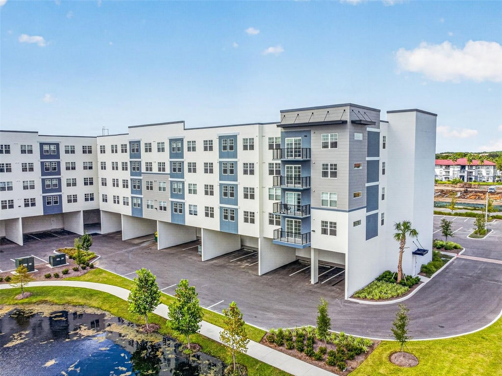 Photo of 5563 Millenia Park Blvd #415, Orlando, FL 32839 (MLS # O6445896)