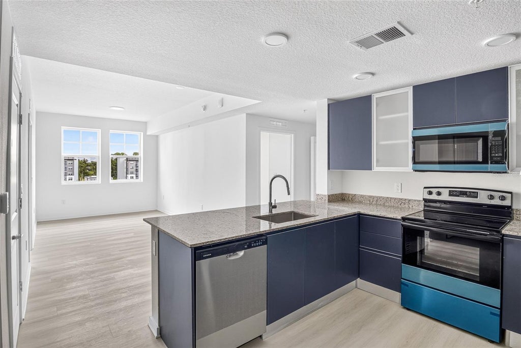 Photo of 5563 Millenia Park Blvd #415, Orlando, FL 32839 (MLS # O6445896)