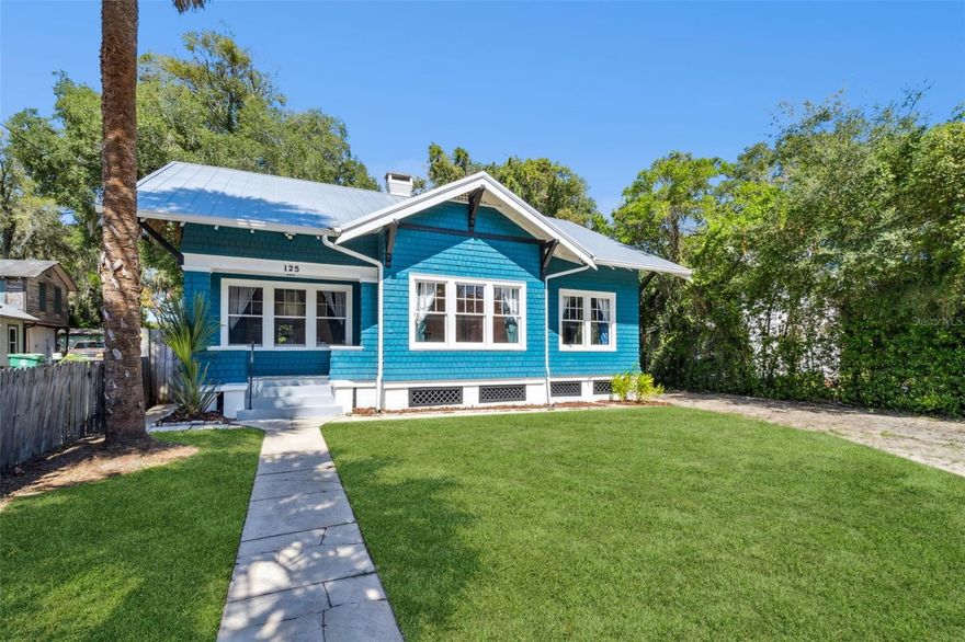 Step into timeless charm and modern luxury in this beautifully restored Craftsman-style home in the heart of Historic Downtown DeLand. Spanning 1,310 square feet, this 3-bedroom, 1-bath residence perfectly blends historic character with high-end contemporary finishes — all within the downtown district’s shops, dining, and events.

Inside, you’ll find 12-foot ceilings, original antique heart pine floors, and an ornamental brick fireplace that anchors the inviting living room. The fully renovated kitchen is a true showpiece featuring brand-new stainless steel appliances (including a built in wine fridge), Carrara marble flooring, quartzite countertops, solid wood cabinetry, a Delta Trinsic faucet and pot filler, farmhouse sink, and a marble backsplash that ties it all together in style.

The upgraded bathroom offers spa-like sophistication with a Kohler Artifacts clawfoot bathtub and fixtures, Kohler vanity with marble top, and Carrara marble tile throughout. 

Additional upgrades include a new standing seam metal roof (2023), tankless gas water heater, and high-efficiency washer and gas dryer. Elegant mid-century modern fans, designer Anthropologie Madelyn Capiz Chandelier and Pendant, and Google Nest smoke detectors add both style and smart convenience.

The detached metal garage can be used as vehicle storage or a workshop with built in 220-volt electric connected.

The large attic, stand-up attic is ready for whatever your imagination might hold!

Enjoy all the character of a classic Craftsman home with the peace of mind of modern upgrades — right in the heart of one of Central Florida’s most vibrant historic districts.