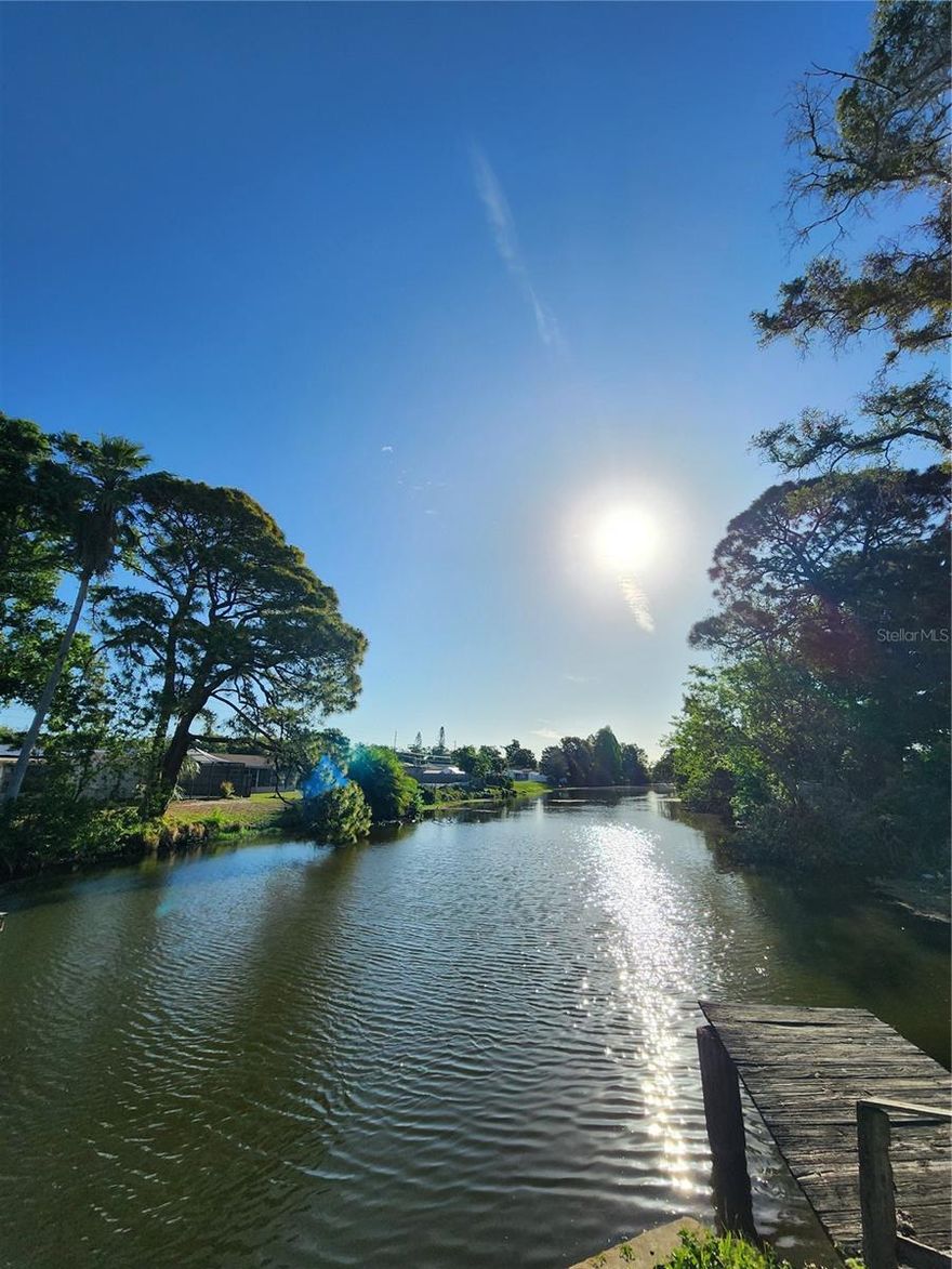 Welcome home to your charming piece of waterfront paradise in North St Petersburg! Updated 2-bedroom, 1 bath home is ready for a new owner. Open floor plan flows throughout the home. You will enjoy the ease of maintenance with luxury vinyl plank floors and ceramic tile throughout. Your new kitchen has stainless appliances and granite counter tops with backsplash. Custom tiled bathroom. The one car garage includes washer/dryer hookups, and plenty of storage for your toys, or vehicle. You will love the close proximity to all of the restaurants, nightlife, and beaches that the St Pete area has to offer. Your new yard offers 2 deck areas for entertaining behind the fully fenced yard. Buyer to verify how many feet of waterfront. Garage is 288 sq ft. Double car driveway with plenty of room to park the boat!