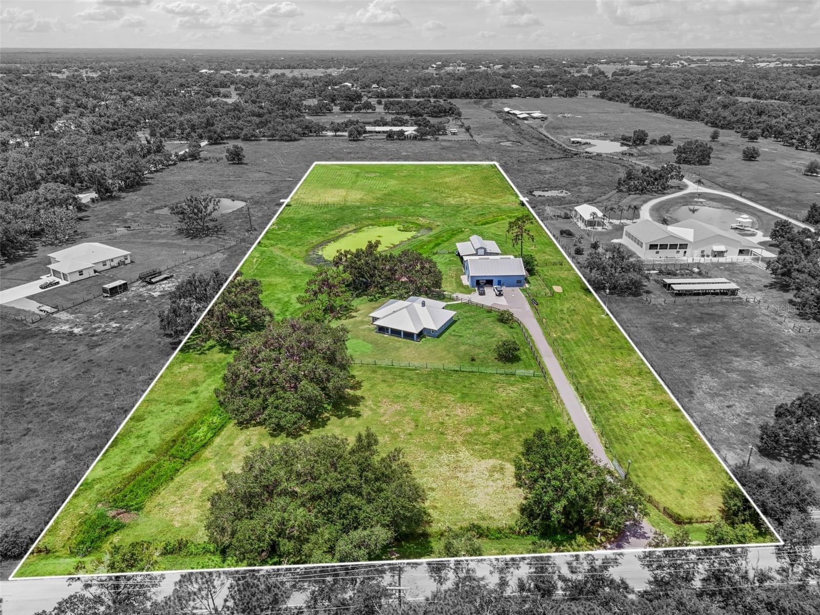 Nestled on an expansive 7.5-acre canvas of pastoral tranquility, this distinguished 1996 block constructed residence offers an extraordinary sanctuary where sophistication meets agricultural charm. The meticulously maintained three bedroom, two bathroom home spans 1,940 square feet of thoughtfully designed living space, complemented by hurricane-resistant windows that blend safety with elegance. And lets not forget the best part, NO HOA and NO DEED RESTRICTIONS and its in flood zone X. Bring all the toys and livestock and have some FUN!
The heart of this property lies in its remarkable outdoor amenities and versatile structures. A substantial 2,260 square-foot detached block garage houses a completely independent 640 square-foot in-law suite, perfect for multi-generational or generating rental income. Above, a spacious loft awaits transformation into a private work out room, artist's studio, or recreational retreat.
Multiple fenced pastures create an idyllic setting for equestrian pursuits or livestock endeavors, while the property's generous acreage provides endless possibilities for outdoor recreation and agricultural ventures. The home's interior showcases solid wood kitchen kickory cabinetry paired with lustrous granite countertops, creating a culinary environment that balances rustic authenticity with contemporary refinement.
Dual screened porches positioned at both front and rear entrances, invite leisurely moments while offering protection from Florida's abundant sunshine and occasional precipitation. Recent exterior painting ensures the property presents impeccably, while the garage's convenient half-bathroom adds practical functionality. Many updates have already been done to the home, metal roof in 2020, hurricane impact windows 2019, A/C system in 2019, a new well in 2020 and the list goes on.
Located within proximity to Old Miakka Preserve, Lakewood Ranch, SRQ airport and our wonderful beaches only 30 minutes away. Residents enjoy easy access to pristine natural environments perfect for hiking, wildlife observation, and outdoor adventures. This unique offering represents a rare opportunity to embrace Florida's agricultural heritage while maintaining modern conveniences and luxurious touches—a perfect blend for those seeking space, privacy, and endless potential in one extraordinary package.