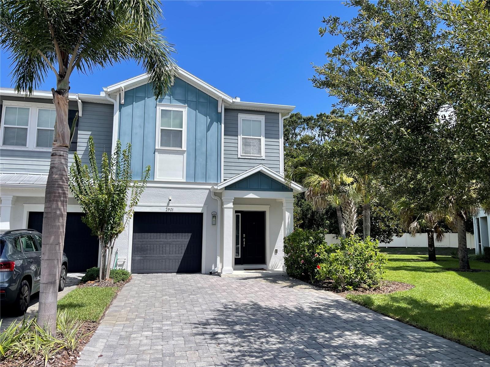 Step into turnkey luxury in the heart of Carrollwood. This beautifully remodeled and fully furnished end-unit townhome offers the perfect blend of modern design, privacy, and unbeatable location, all within a gated community. Every inch of this 3-bedroom, 2.5-bath home has been thoughtfully updated and styled with brand-new furnishings. The main floor features an open-concept kitchen and living area, plus a convenient half bath. Upstairs, you'll find three spacious, fully furnished bedrooms, two full bathrooms, and a bonus family room ideal for kids, guests, or a cozy media space. The layout is perfect for families who want space to relax and spread out, while enjoying the ease of a low-maintenance lifestyle. The attached one-car garage provides additional storage, and being an end unit, you'll enjoy added privacy and natural light. Just steps away from North Lake Park, you'll have access to pickleball courts, tennis, baseball, soccer, football fields, and more making this an exceptional spot for active families. Zoned for top-rated schools and just 20 minutes to Downtown Tampa, with Publix, dining, and entertainment all nearby. Rent includes water, trash, in home security system and lawn care. First month and security deposit required to move in. Schedule your showing today and experience the best of Carrollwood living.