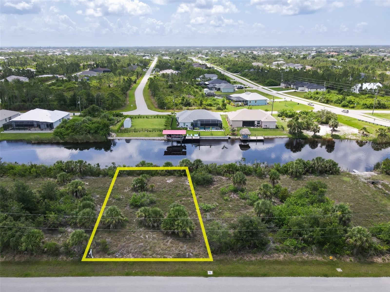 Standard sized WATERFRONT lot located in the highly desirable South Gulf Cove Community. Perfect for building your dream home where you can live the South Florida Lifestyle. Need a builder? Let us introduce you to reputable builders! South Gulf Cove is a deed-restricted neighborhood with an optional HOA. Residents can enjoy South Gulf Cove Park, a water front park with a clubhouse, playground, and public boat ramp only 7 minutes way. Join the boating club here for raft-up parties and boat parades. Boat to the protective lock to find two fresh water rivers, the Gasparilla Sound, the ICW, and of course the Gulf of Mexico. Explore our many barrier islands and sandbars. Play with the dolphins and manatees, fish for Tarpon, dive our sunken boat reefs or pull up to a small beach island for the afternoon. There are several marinas with 5 miles, along with many public and private golf courses within 5 miles and the big public Englewood beach with beach bars and restaurants 12 miles away. If you need to get out of the sun, explore the many boutiques and galleries on Dearborn Street in Englewood or hang at the mall and movie theater in central Port Charlotte.