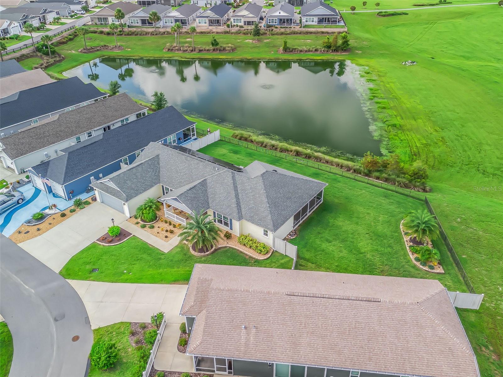Prime Location – One-of-a-Kind with a WATER VIEW!
Welcome to this light-filled 3-Bedroom, 2-Bath Bonifay Courtyard Villa (built in 2021) featuring a desirable split floor plan and vaulted ceilings. This rare gem offers an oversized 4 CAR TANDEM GARAGE with epoxy floors and a Mitsubishi split system—perfect for vehicles, golf carts, or a hobby/man/woman cave.
Inside, you’ll enjoy QUARTZ countertops throughout, no carpet, and an inside laundry. Relax on the screened lanai overlooking the peaceful water view, with plenty of room to add a pool and create your own backyard oasis. Energy-efficient solar panels keep electric bills around $30/month. Offered furnished (list available) and complete with a golf cart included—truly move-in ready!
Community Lifestyle – The Village of Citrus Grove:
Enjoy resort-style living with access to the Citrus Grove Recreation Area featuring an adult pool, bocce, shuffleboard, and corn toss. Just minutes away, explore Sawgrass Grove with shopping, dining, entertainment, Clifton Cove Putting Course, McGrady’s Restaurant & Pub, Sawgrass Market, and the Ezell Regional Recreation Complex. Golfers the Southern Oaks 18-Hole Championship Course—and you’re also close to the exciting New Eastport Villages development for even more future amenities and conveniences!
Don’t miss this rare opportunity—schedule your showing today!