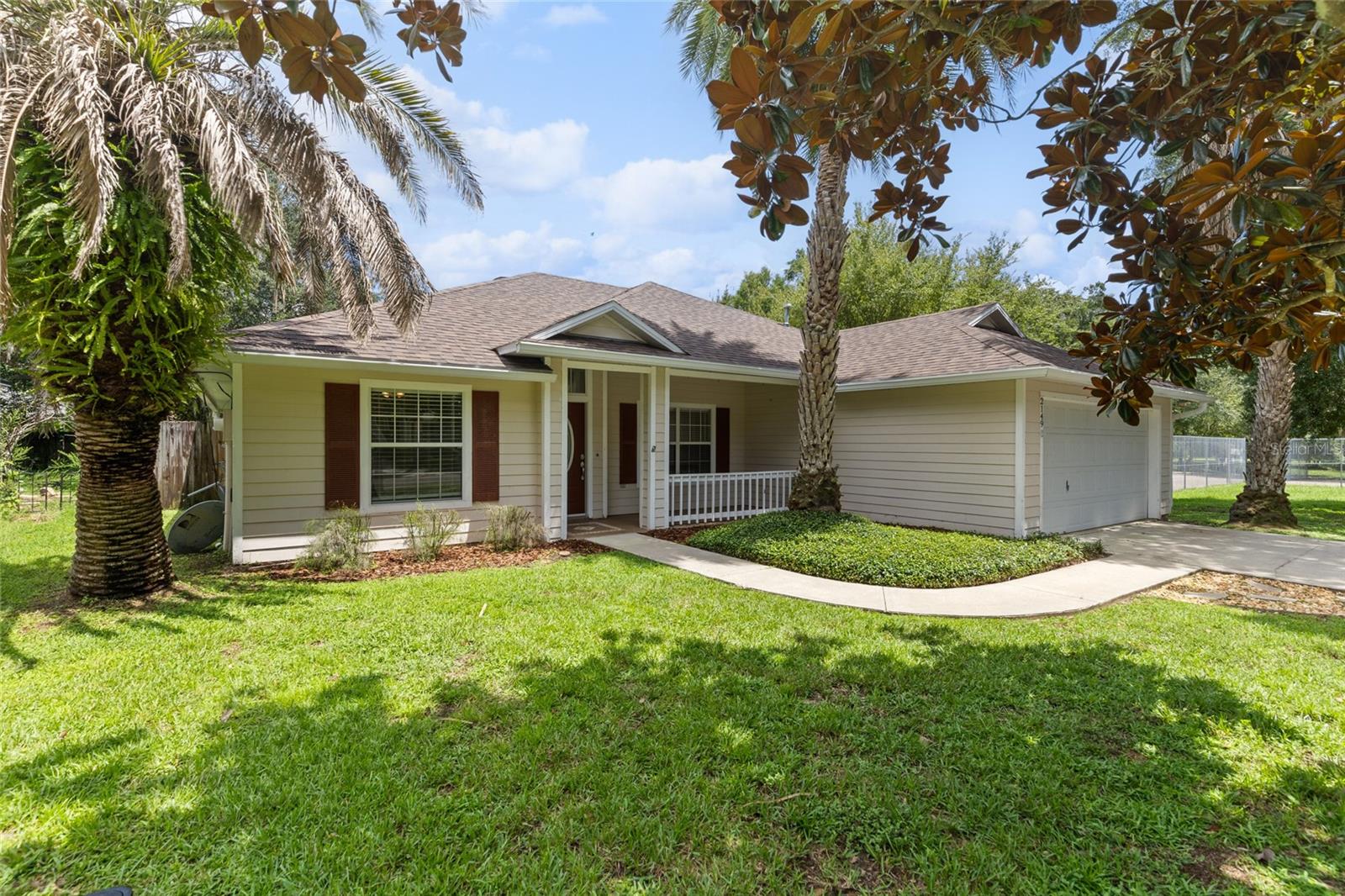 This 3 bedroom 2 bathroom home plus a bonus room offers room to grow, flexibility to fit your lifestyle, and updates that make it truly move-in ready. A brand new roof was just installed this year, all new carpet in the bedrooms were replaced, light fixtures have been updated, appliances are newer, and the hot water heater is only a few years old (2023). If you have been on the hunt for a home that has a split floor plan, spacious rooms, and plenty of living space, look no further. The primary suite is tucked away on its own side of the home and offers tray ceilings, an oversized walk-in closet, dual vanities, and a relaxing garden tub. On the opposite side, the two additional bedrooms are perfect for guests, kids, or both. Don't forget the bonus room that could easily be converted into a 4th bedroom, a study, playroom, or home gym. The best part of the home is the cozy living room, which includes a gas fireplace and built-in shelving. With the kitchen partially open to the space, you will benefit from having both an open concept, yet still having that some separation. Enjoy meals in the eat-in kitchen or host dinners in the formal dining room. Outside, you'll find plenty of yard space and the rare perk of having no side neighbors on one side, along with being right next to the community tennis and basketball courts-it's like having amenities in your own backyard! The home also features a 2-car garage and is perfectly located within biking distance to Hidden Oak Elementary, Fort Clarke Middle, and Santa Fe College. You can't find a better home for this price and in this location. This one checks all the boxes -come see why it’s a standout!