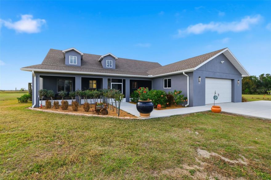 Breath in SPECTACULAR SUNSETS on this 10-acre property in the countryside! Custom built home in 2023 with 5 bedrooms, 4 (full) bathrooms, office, great room, kitchen with large island and seating, walk-in pantry, dedicated laundry room, and a master suite with oversized bedroom with French doors to the 10 x 64 screened covered porch. There’s also a large covered and screened porch in the front!  The master suite has a large bathroom with dual sinks, accessible shower with polished porcelain tile, and large walk-in closet. Matching Samsung appliances. All cabinets throughout home including kitchen, vanity, laundry, etc custom built by Statewide Cabinets. Calacatta Valletta quartz countertops throughout. This house is thoughtfully designed with plenty of power (2) 200-AMP panels, generator connection, 1.5hp well pump, and infrastructure for potential ‘accessory dwelling unit’. Shop also has 200 AMP service. The roofline and gables have isoleyllyene spray foam closed cell on the underside of plywood for efficient air conditioning. Filtered AC returns throughout the home for the best air quality and Reverse Osmosis and water softener for top quality water! This property is all about QUALITY. 
Bring your horses too! Current agricultural exemption for hay. No HOA. This is a MUST SEE home!