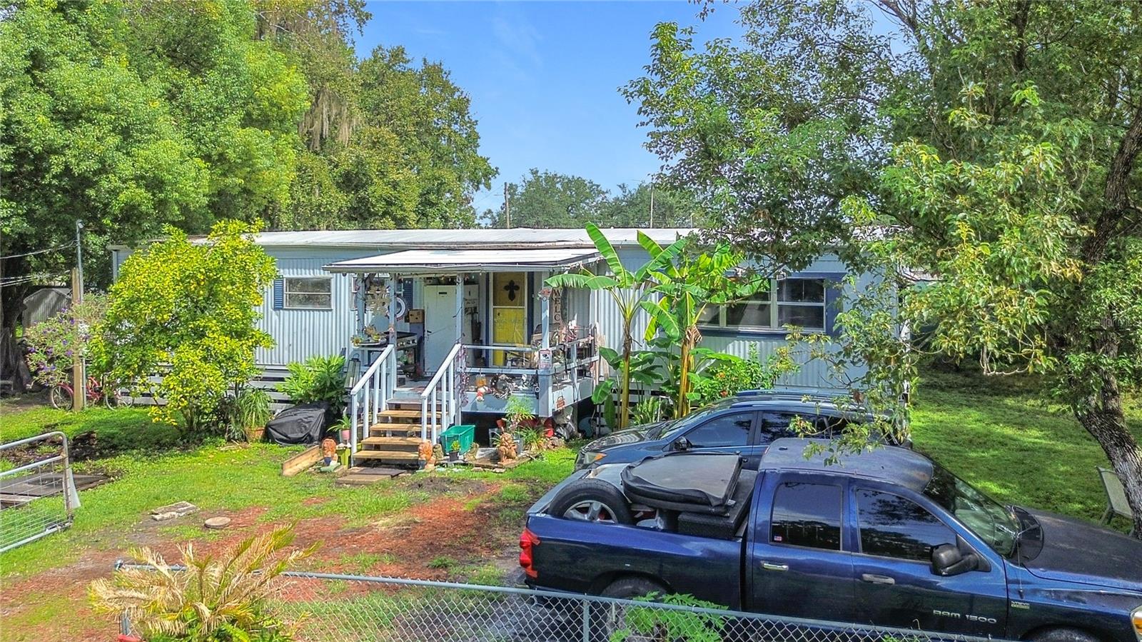 Welcome to this amazing location - this double-wide manufactured home offers spacious living and unbeatable convenience. Situated on a generous .23-acre lot, this home features three bedrooms and two full bathrooms, providing plenty of space for your family or guests.
Key highlights of this home include:
* New Well (2023) – Enjoy fresh, clean water with a brand-new well system installed in 2023.
* Modern HVAC & Water Heater – Both the HVAC and water heater are just 3 years old, ensuring comfort and efficiency year-round.
* New Hurricane Straps (2023) – 24 hurricane straps were added to enhance safety and structural stability.
* Large Lot – A fully fenced, fully usable .23-acre lot gives you room for outdoor activities, gardening, or even expanding.
* Two Sheds with Electricity – This property includes two sheds with electricity, offering ample space for storage, a workshop, or hobbies.
* Prime Location – Just a short drive to downtown Orlando, offering easy access to shopping, dining, and entertainment. The beaches are only 45 minutes away, perfect for weekend getaways or a day of relaxation by the water.
* Stunning Views – Enjoy a unique perk with a view of shuttle launches from your own home—an awe-inspiring experience you won't want to miss!
This home is a fantastic opportunity for anyone looking for a peaceful, spacious, and well-located property. Don't miss your chance to make it yours!