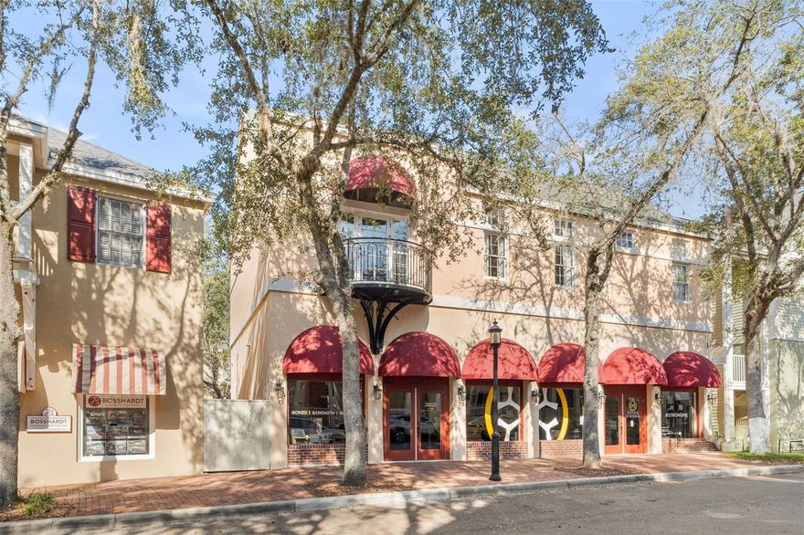 Welcome to the heart of Haile Village Center-one of the most sought-after communities in Gainesville. If you want a lifestyle neighborhood that has coffee shops, restaurants, boutiques, one of the best farmer’s markets, and the most beautiful walking trails, keep reading. This 2 bedroom, 2 bathroom condo overlooks it all. The living space features soaring ceilings, warm wood floors, and a cozy fireplace that anchors the room beautifully. A large glass door opens to your private balcony where you can truly enjoy the perfect place for morning coffee or evening relaxation while taking in the views of the Village below. The arched transom window adds architectural character and floods the space with natural light. The layout offers comfortable separation between bedrooms, making it perfect for guests, roommates, or a home office setup. The kitchen has stainless steel appliances, a dedicated laundry room with washer and dryer included, plus extra storage space. Unlike many condos, this home offers private exterior access, adding an extra layer of privacy and convenience that makes it especially desirable. Set within a golf cart-friendly neighborhood, residents can sign up to be a member of the beautifully maintained private golf course and amenities at Hawkstone Golf & Country Club. Or enjoy access to the pool and playground right around the corner that your HOA fees cover. Want to see what Village living actually feels like? Come experience it in person