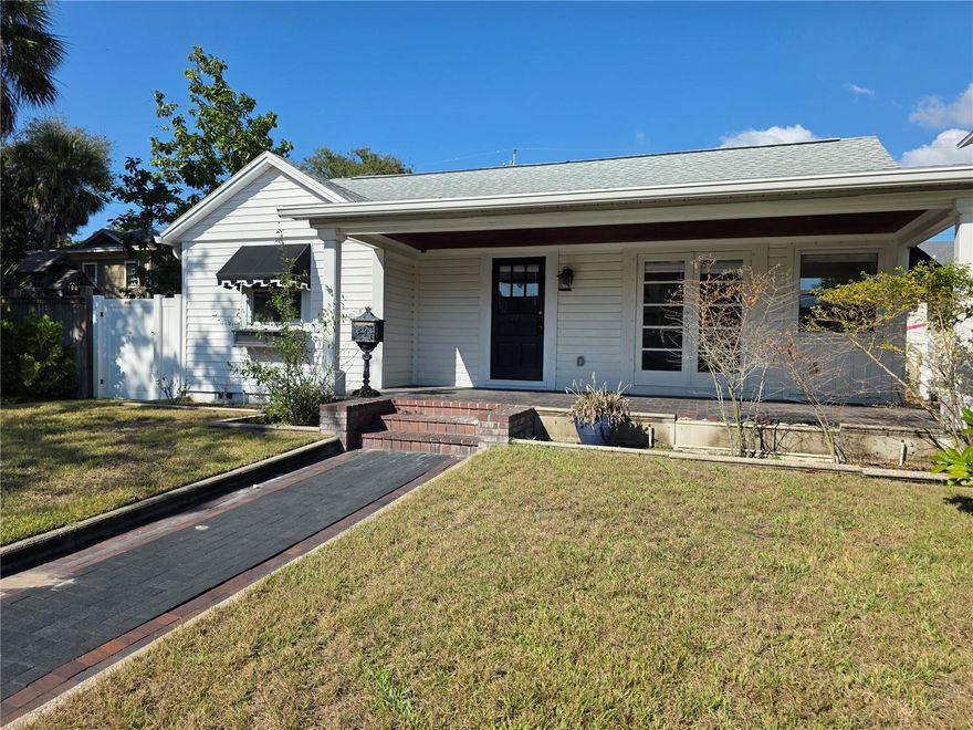 A block down the red brick road to the fabulous Crescent Lake park and just minutes from downtown, this home has it all, especially charm. This 2-bedroom, 1 bath house has original hardwood floors, a new eat-in kitchen, large covered front porch, living room, bonus room, fenced yard, attached one-car garage with alley access and laundry. with tons of natural light and access to the back yard, the bonus room would make a perfect in-home office, art studio or separate dining space.  Move in ready! Sorry no pets and no smoking. Comes unfurnished, annual lease.