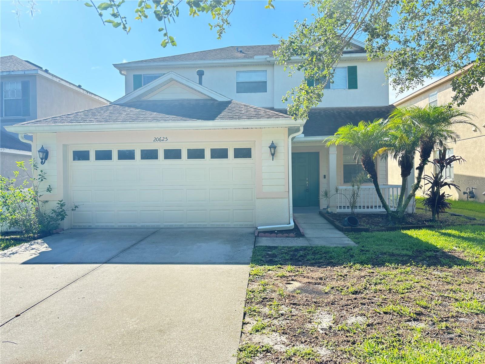 Call today to schedule a tour of this spacious 4 bedroom 2 1/2 bath home nestled in the gated community of Live Oak. Enjoy easy maintenance of tile and laminate flooring throughout. Stainless appliances and granite countertops with a convenient extended area for seating. Large master bath has dual sinks with a separate shower and tub. Fenced in backyard with a beautiful pond view. Close to schools, shopping, dining and entertainment. Less than 30 minutes to downtown Tampa. Move in ready! This one will go fast.