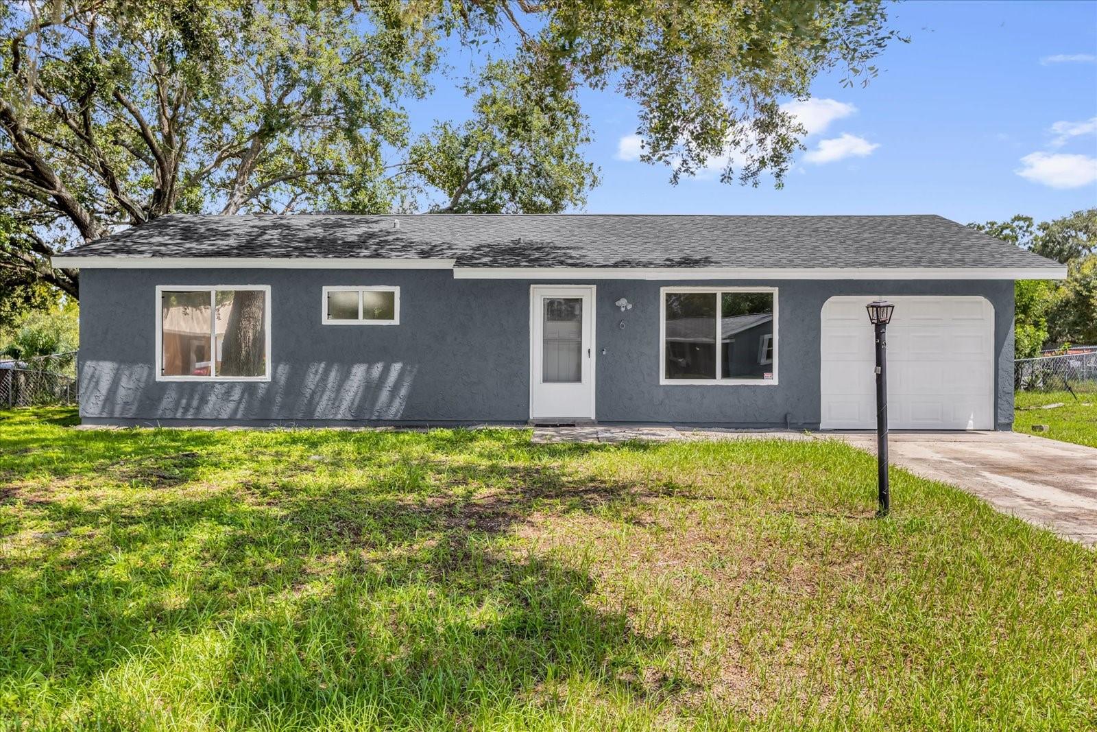 Welcome to your charming Florida retreat! Located in the heart of Ocala, this delightful 3-bedroom home offers the perfect combination of comfort, convenience, and value. With 888 square feet of living space set on a generous 0.23-acre lot, this property feels much more spacious than its size suggests, making it ideal for anyone looking for a peaceful place to call their own. From the moment you step inside, you’ll be impressed by the home’s bright and airy feel. Large windows allow natural sunlight to pour in, creating a warm and welcoming ambiance throughout. The vinyl flooring running seamlessly across the home not only adds style but also makes cleaning and maintenance a breeze—perfect for today’s busy lifestyle. The well-designed floor plan features a Jack-and-Jill bathroom thoughtfully connecting all three bedrooms, providing functionality and easy access for family members or guests. Each bedroom offers a cozy retreat with plenty of natural light and the perfect canvas to create your own personal haven. The kitchen provides ample cabinet and counter space, making meal prep easy and efficient. Whether you enjoy quiet mornings with coffee or lively family dinners, this home provides the perfect setting for making memories.
Step outside, and you’ll fall in love with the expansive backyard. Sitting on nearly a quarter-acre, there’s room for a garden, play area, or even a future outdoor entertaining space. Whether you dream of hosting weekend barbecues, adding a firepit, or simply enjoying Florida’s sunshine, this backyard delivers. Key updates ensure peace of mind for the new homeowner: the roof was replaced in 2023, offering years of protection, while the water heater and AC have been well maintained, so you can move in worry-free. Location is everything, and this home doesn’t disappoint. Nestled in a quiet community with low HOA, you’ll enjoy both privacy and convenience. You’re just a short drive from major highways, making commuting or weekend getaways a breeze. Plus, the area is renowned for its beautiful natural springs, offering plenty of opportunities for outdoor adventures, kayaking, swimming, and exploring all that Florida nature has to offer. Whether you’re seeking a primary residence or a vacation getaway, 6 Hickory Track Pass is a property full of potential. With its modern updates, natural light-filled interiors, and unbeatable location, this home is ready for its next chapter. Don’t miss your chance to own this beautiful Ocala gem. Schedule your private showing today and discover why this home is the perfect fit for you!