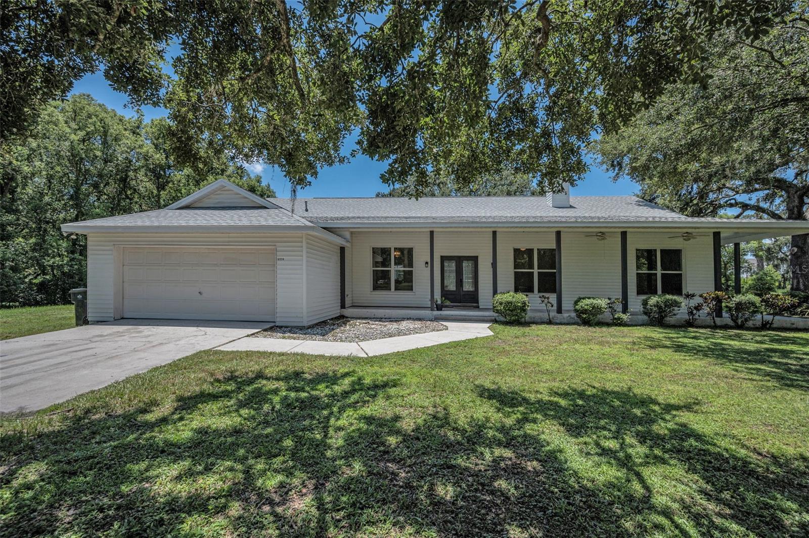 This lovely 3 Bed 3 Bath home has the quintessential feel of “Old Florida” living. As you enter on to the 5+ acre property, the scenic driving path leads you back to a classic style ranch-house…that appears to be straight out of a movie set. From the expansive wrap-around porch to the sprawling greenery which surrounds the home…the overwhelming sense of beauty, peace, and serenity is undeniable. The interior split-bedroom layout transitions smoothly from the oversized kitchen, dining room, and spacious family room (which boasts a wood-burning fire place). This home is ideal for a growing family, and/or multi-generational living. The 3rd bedroom is set up as an “In-Law Suite”, with doors that can partition it off from the rest of the home. The 3rd bedroom features it’s own sitting room, kitchenette, and full-sized bathroom. The home has numerous sliding glass doors and large windows that allow for an abundance of natural lighting throughout. The screen enclosed pool deck can be accessed from almost every room in the house…the main common area, the master bedroom, and the 3rd bedroom’s “cabana” bathroom. The property is located only a few minutes away from I-4 & I-75, which makes getting to Buccaneer, Lighting, or Rays games a convenient commute. Even day-trips to Orlando’s Disney World can be part of a regular routine. This home has far too many features & qualities to list…you really must see it for yourself!!