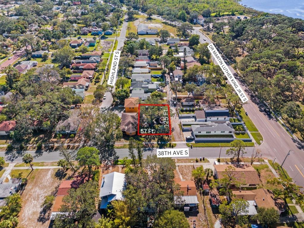 Back on Market. Buyer backed out for "personal reasons". Corner lot zoned NT-1 approved for single family residence with an ADU just off MLK St S, across from Lake Maggiore Park in south St Pete. Dimensions are 57x126 providing a generous 7,090 sq ft for you to build a beautiful home. New builds & developments are starting to pop up in this area so get in while it's still affordable. Just down the street you'll find the local favorite Mullet's Fish Camp & Market as well as the ground breaking development of Coquina Key Shopping Plaza. Probate process is complete. Seller willing to remove trees and fence upon signed contract!