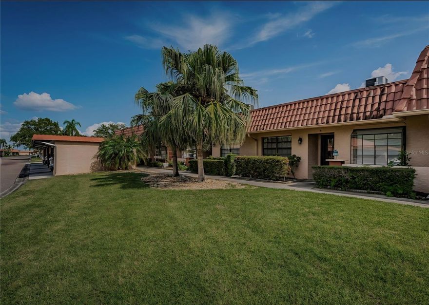 Come see this charming villa located within the waterfront amenity rich community of Imperial Cove. Here you can have it all, everything is included. Heated pool, activities, social director, property manager, ballroom, fitness rooms, sauna, putting green, shuffleboard and so much more. Even cable and internet is included. Villa 10D is located close to "the loop" which is an amazing waterfront sidewalk with sweeping views that winds around the bay and the canal. Dolphins, manatees, and birds of all kinds are ever present. Kitchen offers solid surface counter top and recessed ceiling all appliances included. Primary bedroom and living room have sliders leading onto the Florida room offering additional living space year-round. Inside, you’ll find ample storage throughout, and the absence of carpet means low maintenance with vinyl and tile floors throughout.  A convenient laundry room is located within the unit, adding to the home's functionality. Guest bedroom is located on the front side with guest bathroom beautifully updated, primary bedroom is in the rear with primary bathroom and huge walk in closet. Functional floor plan lends itself so well here for easy living and a carefree lifestyle filled with as many things as you like to keep busy.