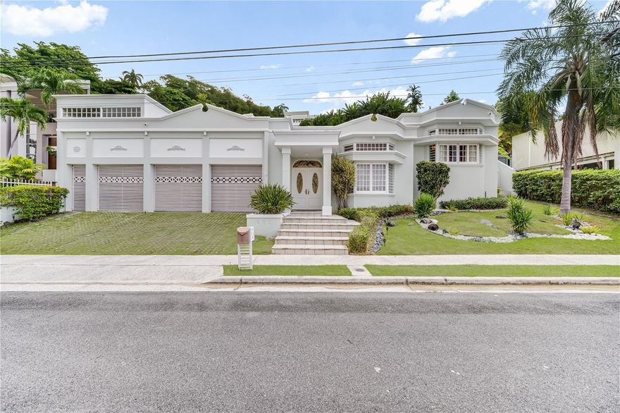 Nestled in one of Guaynabo’s most apreciated  gated communities, this property is a prime opportunity to remodel and make it your own. The two-story home features a spacious second floor with bedrooms, a large kitchen, and a dining area that opens up to a generous terrace and pool—perfect for entertaining. The first floor offers four open rooms that can be customized for a home office, gym, or schooling spaces. Additional features include a 3-car garage,  Priced to sell! Contact us today to arrange a viewing!