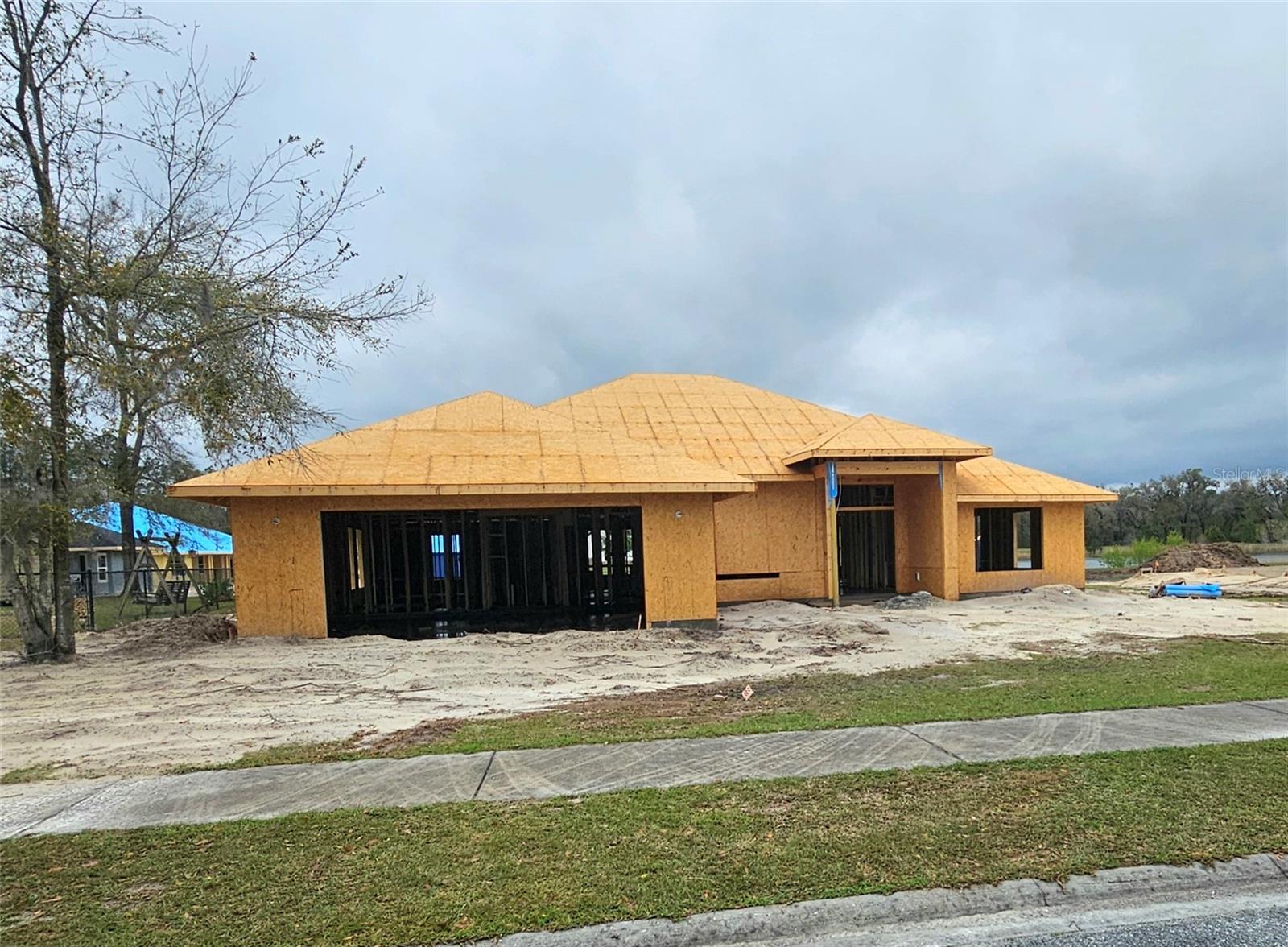 Under Construction. UNDER CONSTRUCTION! PHOTOS SHOWN ARE STOCK PHOTOS OF SIMILAR HOME. COLORS AND MATERIAL VARY. This beautiful 4 bedroom 3 bath home with 2 car garage is being build in the beautiful Preserve at Laurel Lake. Wake up every morning to the beautiful serene view of the pond! This home offers a formal living room and dining room and boasts cathedral ceilings, 5 panel interior doors, 5 1/4 inch baseboards, plus ample windows along the rear of the home for that view! The kitchen includes 36" upper custom wood cabinets with crown molding, soft close doors, granite kitchen counters and energy efficient appliances. The spacious primary suite is complete with a wall to wall walk in shower, two walk in closets and a double sink vanity. Enjoy outdoor entertaining with a beautiful view of the pond!