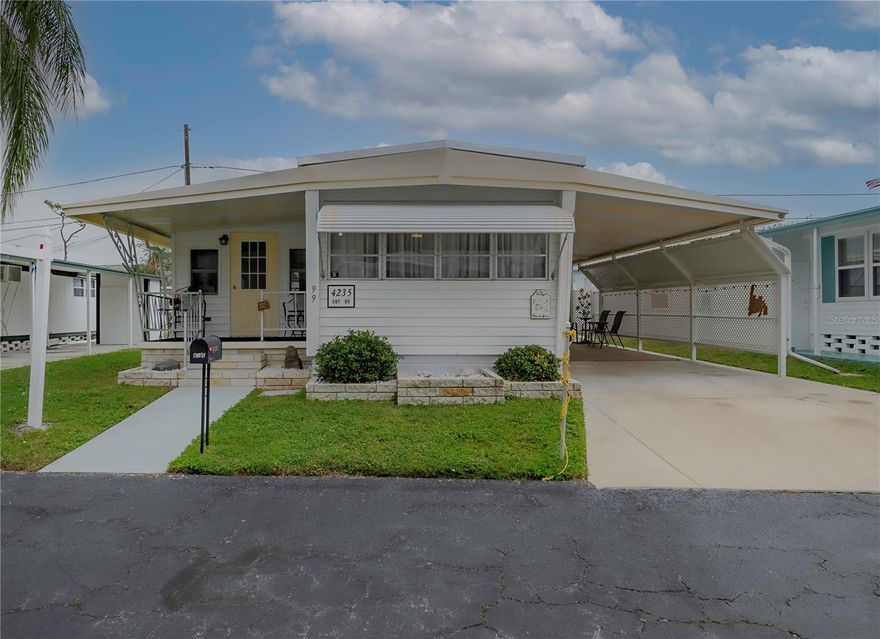 Charming 2 bedroom, 2 bath manufactured home nestled in the highly desirable Magnolia Manor 55+ community. This home featuring vinyl siding with insulation, solid plywood  (under vinyl flooring) and beautiful vinyl flooring throughout, blending durability with modern style.New back patio for living the Florida lifestyle.  The spacious layout includes a comfortable living area, well-appointed kitchen, and two baths for convenient one-floor living. All furniture is included, which also incudes a new sofa with pull out bed.  A two-car carpeted carport offers protection for vehicles and extra outdoor storage space. Additional updates and mechanicals provide peace of mind and enhance long-term value. Residents enjoy Magnolia Manor’s superb community lifestyle with clubhouse, pool, shuffleboard, fitness center, laundry facilities and other amenities included in the HOA fee of $225. Water, sewer, trash and landscaping is also included in the HOA fee.