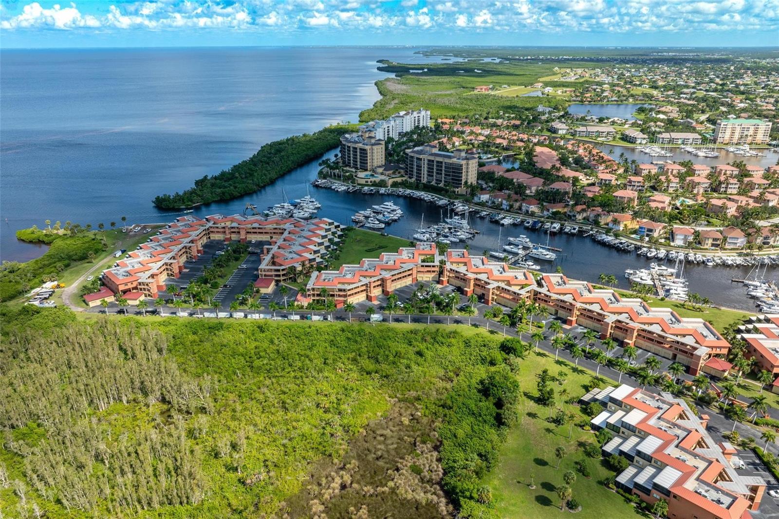Welcome to Marina Southshore, the premier waterfront enclave within Burnt Store Marina & Country Club. This beautifully updated ground-level end unit offers three spacious bedrooms and stunning views of the south marina basin.
An oversized glass-enclosed lanai adds nearly 500 sq ft of living space with panoramic water views—ideal for entertaining or quiet evenings. The bright, open layout features floor-to-ceiling sliders and spacious living/dining areas. The kitchen offers abundant cabinetry, Corian counters, pull-out drawers, new appliances, and a breakfast bar for casual dining.
The primary suite overlooks the harbor and includes a walk-in closet plus a remodeled bath with dual vanities and walk-in shower. Guests enjoy privacy with the split floor plan, oversized bedrooms, and a well-appointed bath. Added conveniences: large laundry room with smart water heater, whole-condo water filtration, and oversized one-car garage with new opener and keypad.
Updates include AC (2022), new LVP/tile/carpet (2024), fresh paint (2024), and new metal roof (2024). Marina Southshore is completing a full exterior community refresh, including fresh exterior paint, new metal roofs, and a beautifully revitalized marina. Residents enjoy resort-style amenities: a heated pool, clubhouse, lush green spaces, and access to Burnt Store Marina’s vibrant lifestyle. With direct access to Charlotte Harbor and the Gulf of Mexico, opportunities for boating, fishing, and water sports are endless. Tennis, pickleball, and social activities foster a welcoming community atmosphere. New photos coming soon showing updated exterior paint scheme and marina updates.