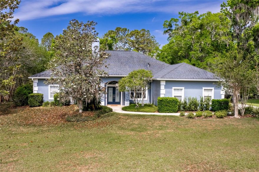 Rare opportunity in popular Carriage Trail. This 4-bedroom, 3-bath home offers 3,158 sq ft of thoughtfully designed space on a 1.01-acre lot. Very affordable HOA. The property includes three distinct living areas, a screened-in pool, and a fenced backyard that backs onto a quiet, private setting. Inside, the home features high ceilings and new hickory hard wood wide plank wood flooring throughout with tile entry. A wood-burning fireplace anchors the front living room, while the climate-controlled Florida room and spacious family room provide flexible space for relaxing or entertaining. The kitchen is equipped with ornate-edge granite countertops, Frigidaire stainless steel appliances, a KitchenAid dishwasher, built-in microwave, pantry, and an eat-in area. The split-bedroom plan includes a generous primary suite with two closets, access to the lanai, and an updated bath featuring a standalone ceramic tub and private water closet. Additional features include a two-car garage with extra storage, a tiled laundry room with counter space. Located near the Country Club of Ocala and the Florida Greenway and Santos Trail, with convenient access to golf, cycling, dining, and recreation. Carriage Trail is a hidden gem community with houses on one acre lots in a very convenient central location. This is a house you will want to see and make it yours! Call to schedule a showing today.