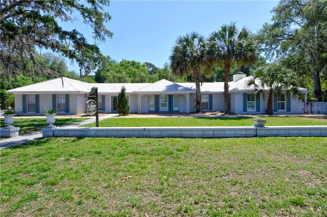 YOUR SEARCH IS OVER! This commercial real estate opportunity is incredibly rare. The location and visibility are both fantastic. 262 Feet of Road Frontage. The access is superior. It is four parcels totaling 1.99 +/- acres. B2 Zoning. This site is adjacent to Walmart and very close to a wide variety of restaurants, shopping, etc. This offering also includes a 2/2 home with two separate attached 1/1 apartments. There is also an additional storage facility on the property. The possibilities and potential are endless. Too many other details to list. Set up a showing today.