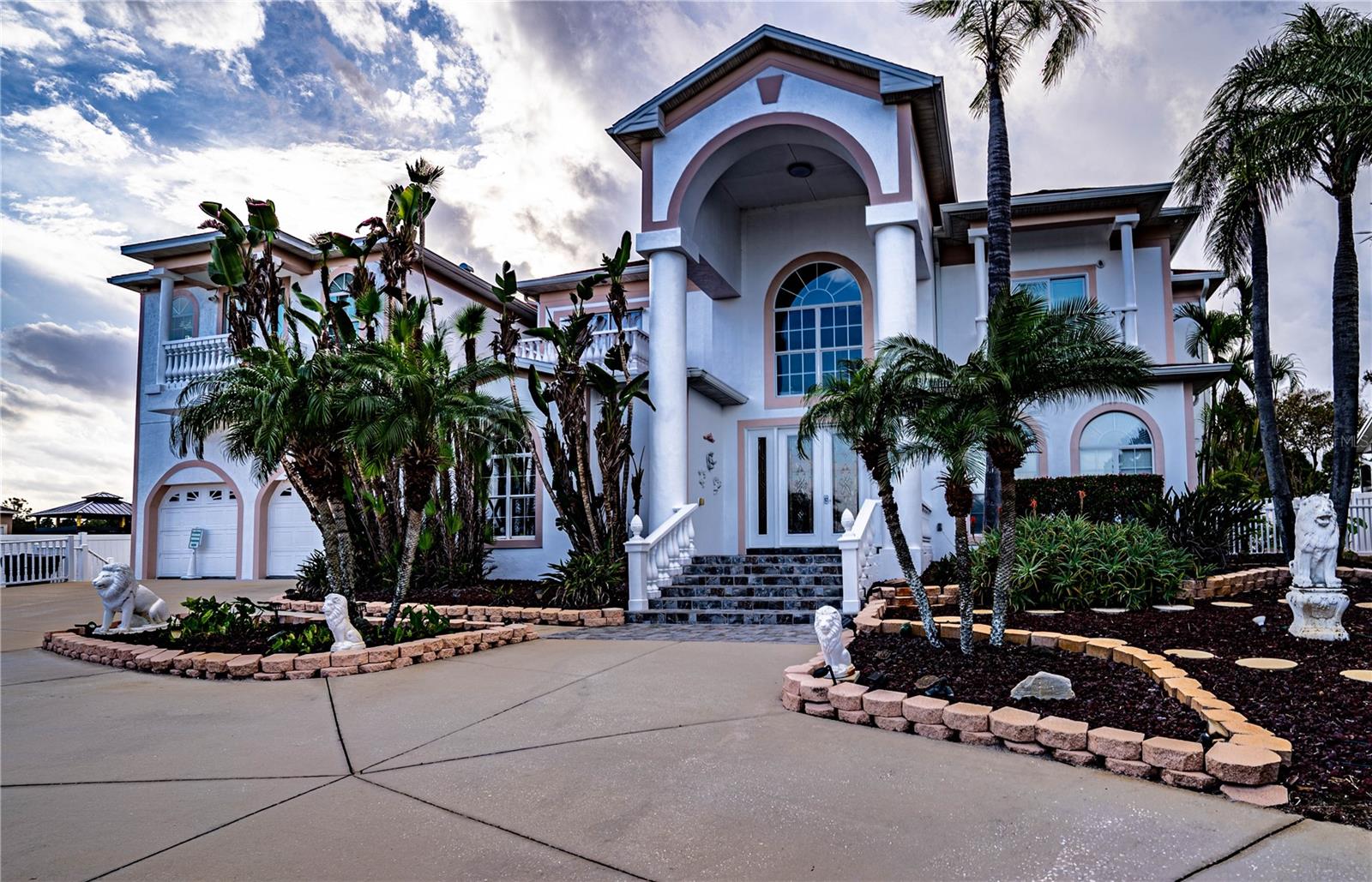 Welcome to your dream home at 3001 Crystal Beach Road in Winter Haven, FL—a masterpiece of luxury and sophistication. This breathtaking 8-bedroom, 7-bathroom estate redefines opulence, offering unparalleled features and amenities designed for both grand entertaining and everyday indulgence.
As you step into this expansive residence, you'll be captivated by the soaring high ceilings, elegant window treatments, and thoughtfully curated living spaces. The interior boasts a game room, media room, spacious loft, and a second-floor balcony with tranquil views. The layout is as functional as it is stunning, featuring a kitchen/family room combo, a living room/dining room combo, and an in-law suite on the second floor for ultimate privacy and convenience. The primary bedroom is a true retreat, showcasing luxurious solid surface and stone counters, walk-in closets, and premium finishes.
The outdoor spaces are equally impressive. A private playground in the backyard adds family-friendly charm, while the dual indoor and outdoor swimming pools provide year-round enjoyment and relaxation. Whether hosting lavish gatherings or intimate get-togethers, the covered patio and meticulously landscaped grounds create the perfect setting.
This estate also presents an incredible investment opportunity, with its size, layout, and amenities making it ideal for use as a luxury Airbnb or vacation rental. From the stunning features to the sought-after location, it’s perfectly positioned to attract high-end travelers seeking a one-of-a-kind experience.
Car enthusiasts will appreciate the oversized 5-car attached garage with ample space for vehicles, boat parking, and a circular driveway that adds an air of grandeur. Every detail of this estate has been crafted to offer the pinnacle of style, comfort, and function.
Don’t miss this rare opportunity to own a property that truly has it all. Schedule your private tour today and experience the lifestyle—and potential income—you’ve always dreamed of!