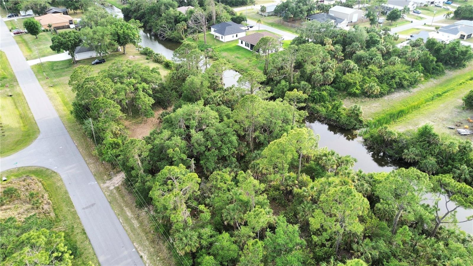 GREAT LOT WITH FRESH WATER CANAL in the back. Discover the perfect opportunity to own a piece of North Port, FL, in the heart of a rapidly expanding area. Great vacant lot near famous Warm Mineral Spring Lake, a local gem and Wallen Park downtown area and the highly anticipated new Costco store. Great opportunity to buy and build in the heart of fast growing area of North Port, FL. This property is perfectly situated near shopping centers, a variety of dining options, beautiful parks, stunning beaches, and world-class golf courses. Easy access to U.S 41 and Interstate 75 for smooth commuting and travel. Enjoy the freedom of no HOA, Deed Restrictions, or CDD fees, making it an ideal canvas for your dreams. Don't let this incredible property pass you by. Seize the moment to invest in this exceptional opportunity. Your dream home or investment project awaits!