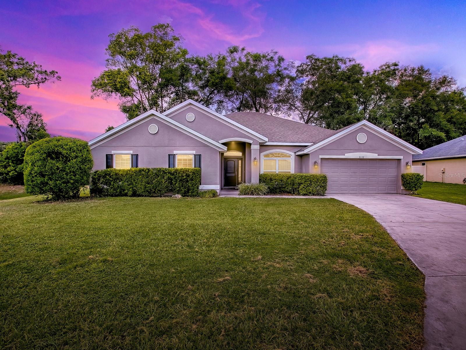 Escape to the serene oasis of Magnolia Pointe, a gated community just outside of town, offering the perfect blend of convenience and tranquility. This stunning home is tucked away in a private location, next to a retention area, ensuring a peaceful and secluded atmosphere.
As you approach the property, you'll be greeted by its impressive front elevation, complete with a two-car garage and a beautifully designed entrance. The tiled foyer entry sets the tone for the elegant interior, with a front door featuring a sidelight and top transom window that allows for an abundance of natural light.
Inside, the vaulted ceilings and plant shelves create a sense of openness and airiness, while the vinyl flooring throughout (except in the wet areas, where tile is used) adds a touch of practicality and style. The expansive kitchen is the heart of the home, boasting an island, coffee bar, stainless steel appliances and recessed lighting that creates a warm and inviting atmosphere. Enjoy meals at the kitchen counter, breakfast nook, or formal dining room - the options are endless.
The primary suite is a serene retreat, featuring a tray ceiling framed with crown molding and a beautifully appointed bathroom with a soaking tub, wavy block window,glassed shower, dual vanity, and separate water closet. The other three bedrooms are generously sized, with walk-in closets behind designer doors that add a touch of luxury. There are also 2 other bathrooms to accommodate your guests or large family.
Out onto the covered lanai, you'll be treated to lovely views of the large, privacy-fenced rear yard, perfect for outdoor entertaining, relaxation, or whatever activities bring you joy. Whether you're looking for a peaceful retreat or an entertaining paradise, this home has it all.
With its perfect blend of style, comfort, and practicality, this Magnolia Pointe home is the perfect haven for anyone seeking a serene and luxurious lifestyle.