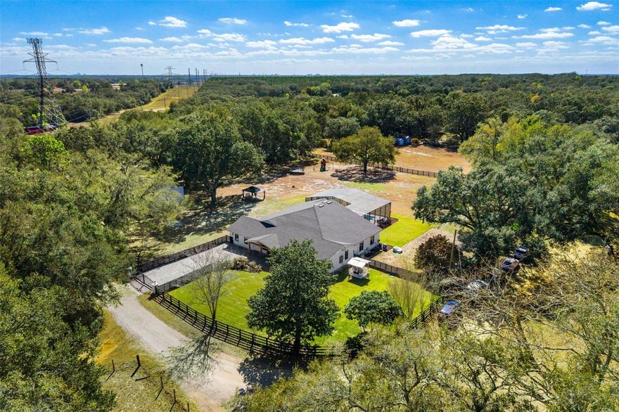A rare opportunity for a completely renovated home in rural Avalon Groves and no HOA. Situated on 2.5 private acres, this beautifully remodeled farmhouse inspired estate offers peaceful country living with modern comfort and thoughtful design throughout. This spacious home features 6 bedrooms and 3.5 bathrooms and has been extensively updated within the last year. New septic tank added (now making 2 septic tanks in 2026). New roof. Tankless hot water heater. Brand new gates and fencing. The interior offers open living spaces filled with natural light, high quality finishes, and top of the line appliances throughout. Every detail has been carefully selected to create a warm and welcoming atmosphere while maintaining functionality for everyday living. The primary suite serves as a private retreat, highlighted by an expansive bathroom that is comparable in size to a bedroom. Designed for comfort and relaxation, this space offers both luxury and privacy. Outdoors, the property continues to impress with a private pool and generous acreage providing flexibility for a variety of uses. Dedicated boat and RV storage offers added convenience for those who enjoy an active lifestyle. Two separate private gated entrances provide enhanced accessibility and privacy. This property presents a rare opportunity to enjoy acreage living while still benefiting from modern updates and refined finishes in the Rural Avalon Groves area, while being only 5 minutes away from all your shopping, restaurants and groceries.