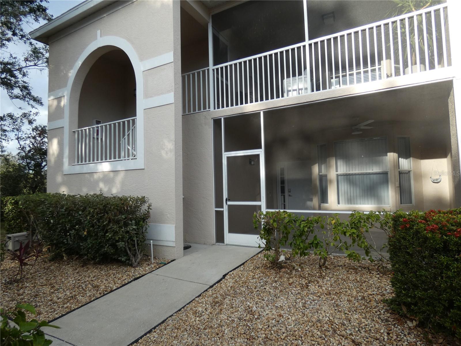 RENTED FEB., MARCH., APRIL 2026: AVAILABLE APRIL THROUGH DEC. Abbey Model, largest of the verandas, available now, spacious and comfortable, king bed in the primary bedroom, TV mounted on the wall, Bay window, new vinyl flooring, adjoining master bath has twin sinks, soaking tub and glass walk in shower. The living room has a new sofa and love seat, large TV, and there are sliding glass doors that open to the glass-enclosed lanai featuring a gorgeous view of the lake and golf course. The kitchen is well stocked, has a cooktop stove, stone countertops, eating space in front of the windows, and is open to the dining area which is separated by the breakfast bar. There are two guest bedrooms and a guest bathroom. There are bikes in the garage and the heated community pool is a short distance from the condo. There is the opportunity to transfer the golf or social membership for a fee (contact clubhouse for the fee schedule) which provides access to the newly modernized Kipp Schultes-designed golf course, the pro shop, the well-equipped fitness center, and main heated pool. There are several Har-Tru lighted tennis courts and you will enjoy the many activities the country club has to offer like yoga, mahjong, and much more. The community borders the Legacy Walking and biking trail, is less than 15 minutes from Siesta Key beaches, shops and restaurants and you can be downtown Sarasota to enjoy the cultural and culinary activities Sarasota in known for.