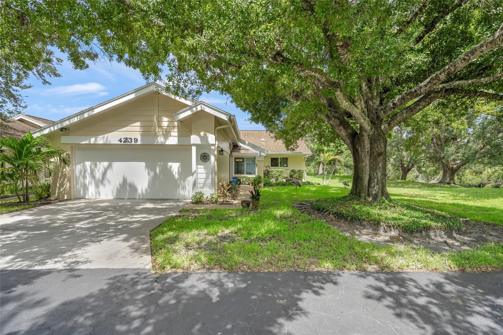"Buy the Location, We'll Include the Villa!"
Tucked away on a private cul-de-sac in the sought-after Knolls of Bent Tree, this beautifully updated and impeccably maintained 2-bedroom, 2-bath villa offers the best of peaceful Florida living. Enjoy serene views of an expansive greenbelt and gentle stream from your enclosed, air-conditioned lanai—your own private sanctuary frequented by cranes, deer, and other friendly wildlife.
Inside, you’ll find a formal living and dining room, an updated eat-in kitchen, and two spacious bedrooms, including a primary suite with ensuite bath and skylight. The villa also features an attached 2-car garage and sits within a quiet, well-kept community of just 52 freestanding villas and townhomes.
This is one property you truly must see to appreciate. Superb setting, thoughtful updates, and move-in ready comfort—all in one rare find. Home has impact windows, new A/C & Water Heater, roof (2013)