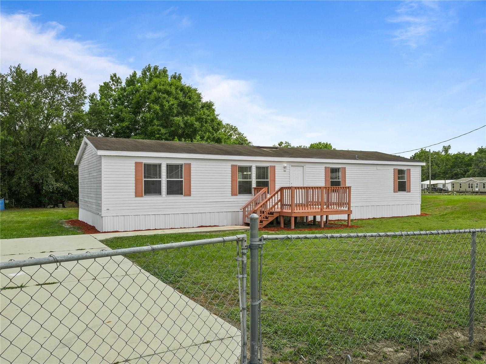 Photo 4 of 36 of 1302 WINDSONG DRIVE mobile home