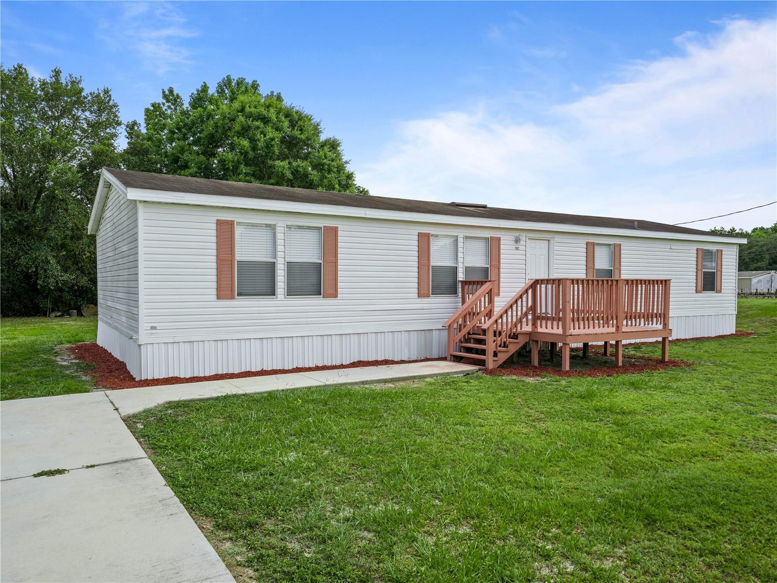 Photo 3 of 36 of 1302 WINDSONG DRIVE mobile home