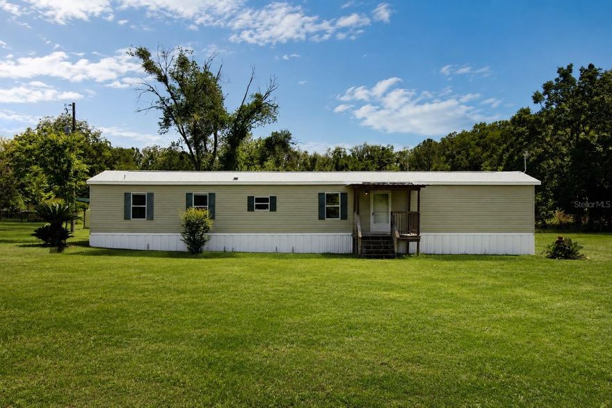 Discover this beautifully remodeled 3-bedroom, 2-bathroom home situated on 5 picturesque acres in the desirable town of Newberry! This move-in ready property features a brand-new roof, new hot water heater, and a 2020 HVAC system for peace of mind. Inside, you’ll find vinyl plank flooring throughout, making maintenance easy and efficient, along with an abundance of natural light that creates a bright and inviting atmosphere. The open-concept layout is perfect for entertaining, while the updated kitchen boasts new countertops and stainless steel appliances. The split floor plan offers added privacy, and indoor laundry hookups provide extra convenience. Step outside and enjoy your morning coffee on the back porch overlooking the beautiful property. The land is set up perfectly for animal lovers with fully fenced pastures, an additional barn, and a large enclosed metal building/garage ideal for storing recreational vehicles, equipment, or creating the perfect workshop. Enjoy peaceful country living while still being conveniently located near town amenities. Call today for your private showing — this property will not last long!