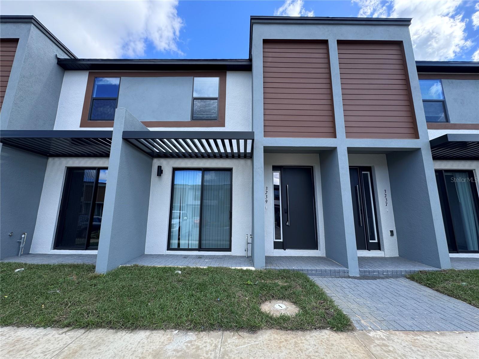 3239 Sustainable Way in Kissimmee, FL is a newly built 3-bedroom, 3-bath townhouse offering 1,361 sq?ft of modern living space. Each bedroom features a private en-suite bathroom, with one bedroom on the first floor and two upstairs flanking a versatile bonus area. The home includes stainless steel appliances, laminate flooring, in-unit laundry, and an open-concept living area. Built in 2024, it's located in a developing community near major attractions like Disney World. Local schools include Westside K–8 and Celebration High School, with charter options like Four Corners Charter also nearby. Shopping centers such as Shoppes at Vista del Lago and Maingate West Flea Market are within 1–2 miles. Future community amenities are planned, including a pool, fitness center, and clubhouse. The home is pet-friendly and ideal for families, roommates, or professionals seeking flexible space. Schedule your showing today!