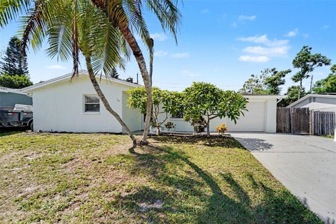 Photo of 1539 Plum Tree Road, Holiday, FL 34690 (MLS # O6446257)