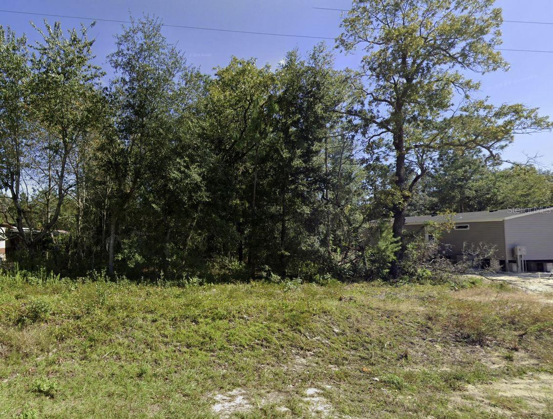 Dreaming of your own Florida getaway? This buildable lot in Interlachen Lakes Estates offers the freedom and flexibility to make it happen! Zoned Residential-2, you can build a custom home, place a mobile or modular (code-compliant) home—even go tiny, with no minimum square footage required if built to Florida Building Code.
Enjoy peaceful surroundings with plenty of space to design the lifestyle you want. RVs aren’t allowed permanently, but temporary use during construction is permitted with proper approvals. Affordable land, flexible options, and a growing community—don’t miss this opportunity! Please verify all plans and permitted uses with Putnam County. All structures must meet current code requirements.