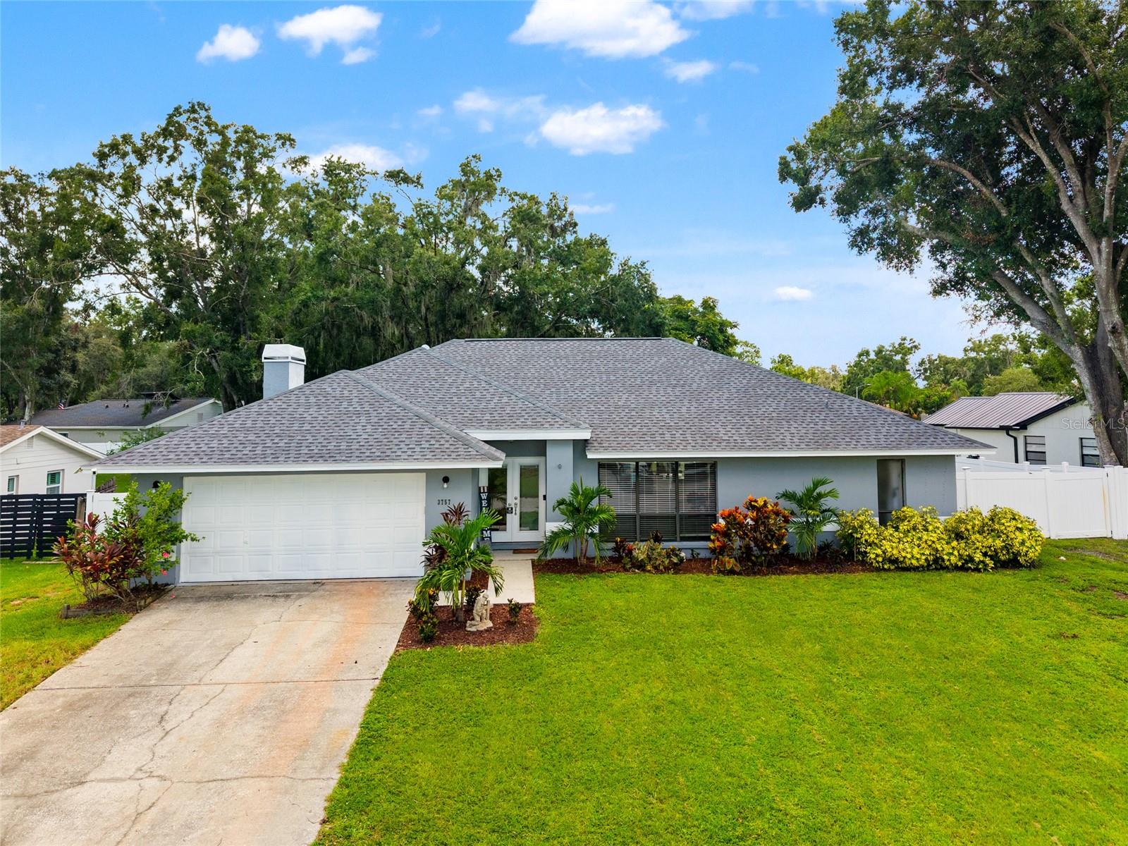 Welcome to Lake Padgett and E Lake Drive — a true Florida retreat in the southern part of Land O’ Lakes. Set on a large fenced lot with no HOA, this 4-bedroom, 2-bath, single-story pool home offers not just space, but the freedom to live life your way.
The heart of the home is designed for both family living and entertaining. The kitchen, dining, and family room flow together with vaulted ceilings and a cozy wood-burning fireplace, while the split floor plan provides privacy for the spacious primary suite. Step through sliding doors and you’re in your own backyard oasis: a screened lanai with a sparkling pool, covered seating, and plenty of deck space for cookouts, football gatherings, or quiet evenings in the Florida sun.
The oversized garage and expansive fenced yard provide room for your boat, RV, or work truck — and the independence of no HOA means you make the rules. Whether it’s hobbies, storage, or simply enjoying the peace and quiet, this property gives you flexibility few communities can provide.
Living here also means being part of a community that values independence. Land O’ Lakes is filled with lakes for fishing and boating, local BBQ and family-owned restaurants, and neighborhoods where folks look out for each other but respect your space. With quick access to Wesley Chapel, Lutz, and Tampa, everything you need is within reach — without sacrificing the serenity of your own retreat.
If you’ve been looking for a home that blends independence, family comfort, and outdoor living, this is it. Schedule your private showing today and see how this home can support your family’s next chapter.
