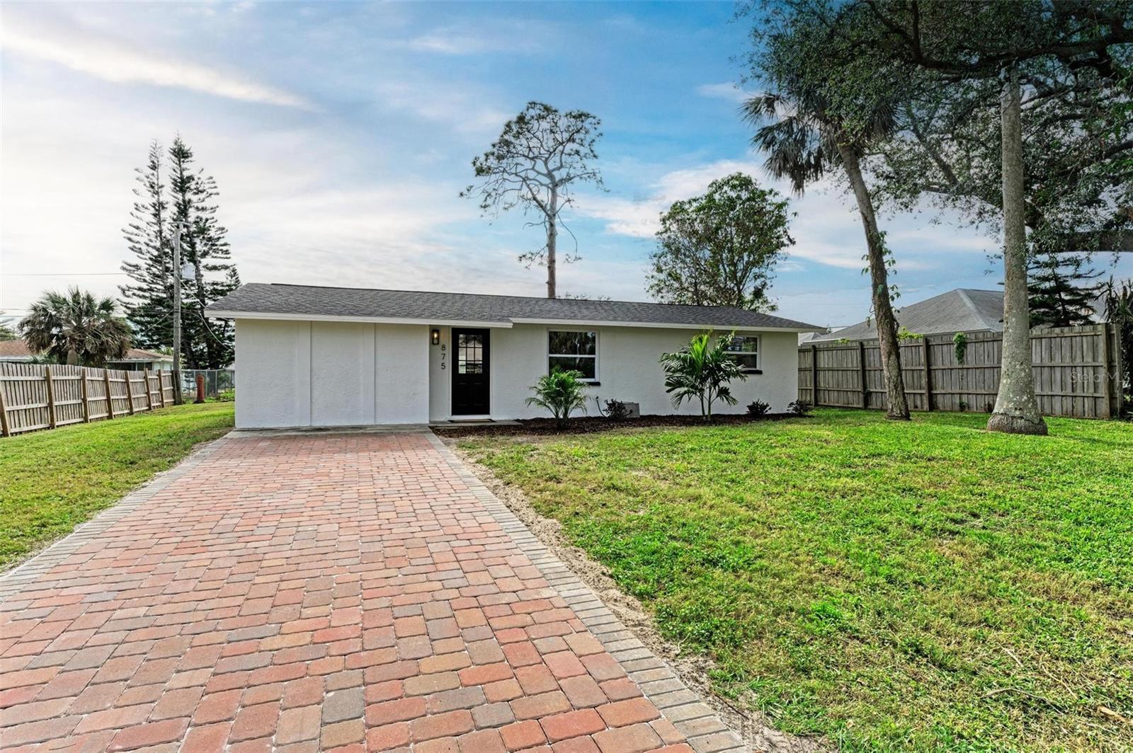 One or more photo(s) has been virtually staged. **PRICE REDUCED, MOTIVATED SELLER-OFFERING BUYER CONCESSIONS**Welcome to South Venice. This newly updated home is perfect for first time buyer, investor or retiree. Move in ready. 3 bedrooms, 1 bath, plus bonus room. NO HOA OR CDD FEES!! ALL NEW IN 2024!! - Roof, impact windows, well pump, HVAC, electric panel, water heater, kitchen cabinets, counters, appliances, flooring, shiplap accents, tongue and groove ceiling, new bath, and new paver driveway. Open and bright with neutral colors. Large lot with shed. Room for toys or pool! Indoor utility with washer/dryer hookup. Optional membership available to the South Venice Ferry Assn. is available for $180 a year which includes deeded beach, boat ramp, ferry, kayak launch, pavilion and more. West of US 41, flood zone X. All major warranties are transferable.