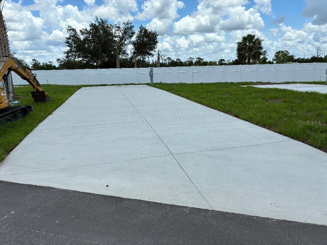 RV Pad in Premium Location in Luxurious RV Resort - Palm Breeze of Punta Gorda. New and exclusive amenity-rich RV resort with professional management. Site can generate income when you're not using it with the professional resort management service! Convenient to Dozens of White- Diamond Sand Florida Beaches. Fishing Piers on 3 Stocked Ponds. New Resort Style Pool and Hot Tub. Tiki Bar. On-Site Provisions Store, Golf Cart and Bicycle Rentals. Community Center with Shower Suites and Laundry Facilities. Fitness Center. Pickleball Courts, Bocce Ball, and Shuffle Board. Putting Green, Dog Park. Paved Roads. Site offers Water, Power, Sewer, and Community Wifi. Premium lot located adjacent to the clubhouse! See pics!