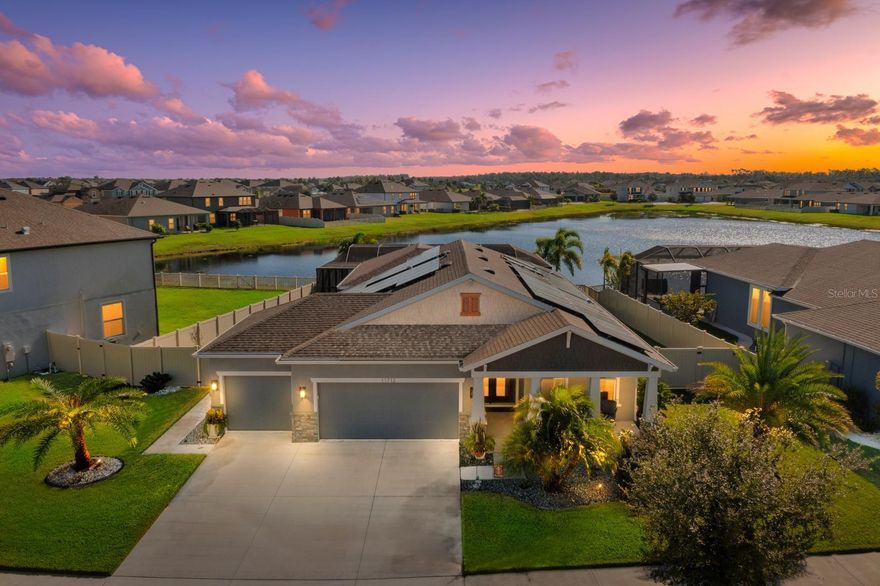 Incredible opportunity with a 2.25% assumable VA loan and paid-off solar panels that keep your electric bill around $15 a month! This beautiful 4-bedroom, 2.5-bathroom home with a 3-car garage perfectly combines affordability and luxury, featuring a heated pool and spa with a breathtaking 180-degree water view.
Located in the sought-after Reserve at Pradera community, this home offers resort-style living and modern energy efficiency. The charming bungalow front elevation with a welcoming porch and Florida-friendly landscaping creates a warm first impression. Freshly painted inside and out, the home features 8-foot doors, crown molding, and elegant finishes throughout. The gourmet kitchen showcases upgraded cabinetry, an oversized island, and a walk-in pantry—ideal for both entertaining and everyday living. The open layout of the kitchen, dining room, and family room provides sweeping views of the backyard oasis, where the screened lanai, pool, and spa overlook the serene water.
The owner’s suite is a luxurious retreat featuring tray ceilings, a garden soaking tub, dual sinks, and a seamless glass shower. The fourth bedroom with double doors makes a perfect office, gym, or guest room with plenty of natural sunlight and an open, airy feel. Additional bedrooms offer flexibility for family and guests.
This energy-efficient home includes an insulated 3-car garage with epoxy flooring, a water softener system, and well-planned landscaping and drainage for easy maintenance. Conveniently located near shopping, dining, and major highways, this home truly defines where luxury meets affordability in The Reserve at Pradera.