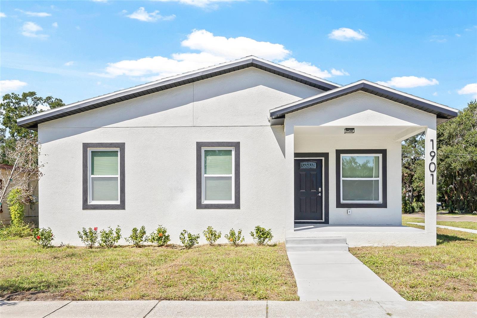 Welcome to this one-of-a-kind NEW CONSTRUCTION home in the heart of St. Petersburg! Thoughtfully designed with modern finishes and versatile living options, this property features a MAIN RESIDENCE with 1,440 sq ft of living space (3 bedrooms, 2 bathrooms) plus a rare detached 3-CAR GARAGE topped by a fully equipped 2-bedroom, 1-bathroom ACCESSORY DWELLING UNIT (ADU)—perfect for multi-generational living, a private guest suite, or additional rental income. Step onto the inviting front porch and into a bright, sunlit open floor plan where the living room, dining area, and kitchen flow seamlessly together—perfect for entertaining or everyday living. The modern kitchen is a showstopper, featuring brand-new stainless steel appliances, contemporary cabinetry, a spacious island, and plenty of storage and prep space. The split floor plan offers comfort and privacy, with the primary suite tucked away on one side of the home. Here, you’ll find a generous walk-in closet, a built-in closet, and an ensuite bathroom with sleek finishes. On the opposite side, two guest bedrooms share a beautifully appointed full bath, along with a convenient indoor laundry room. Outside, the detached three-car garage provides plenty of parking and storage. Above the garage, the fully finished 2-bedroom, 1-bathroom ADU boasts its own kitchen with stainless steel appliances, a living and dining space, and private entry—perfect as a guest suite, rental, or home office. With everything brand new—including the roof, HVAC system, water heater, and windows—this property offers the worry-free lifestyle of modern construction. Ideally located less than 10 minutes from vibrant Downtown St. Pete, just a short drive to award-winning Gulf beaches, and surrounded by shops, restaurants, and entertainment, this one-of-a-kind property delivers lifestyle, location, and income potential all in one. Don’t miss the opportunity to make this stunning new construction home yours—schedule your private showing today!