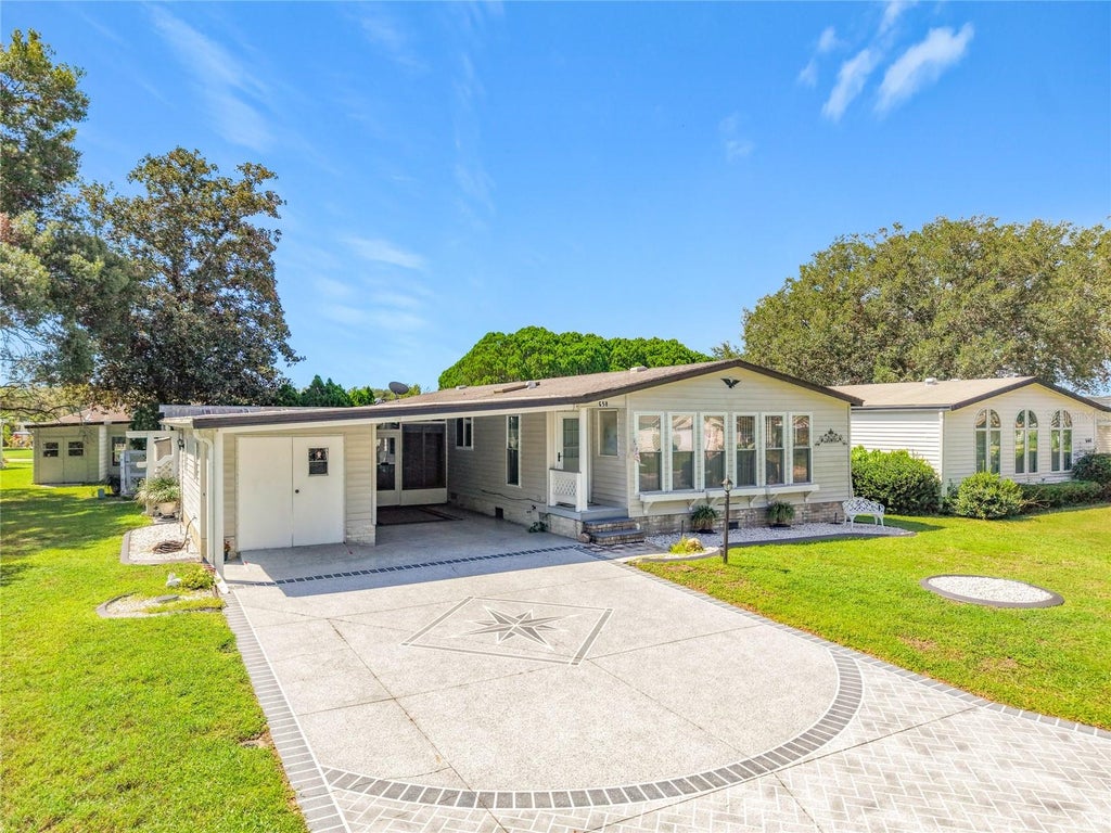 Photo of 658 Rainbow Boulevard, Lady Lake, FL 32159 (MLS # G5117705)