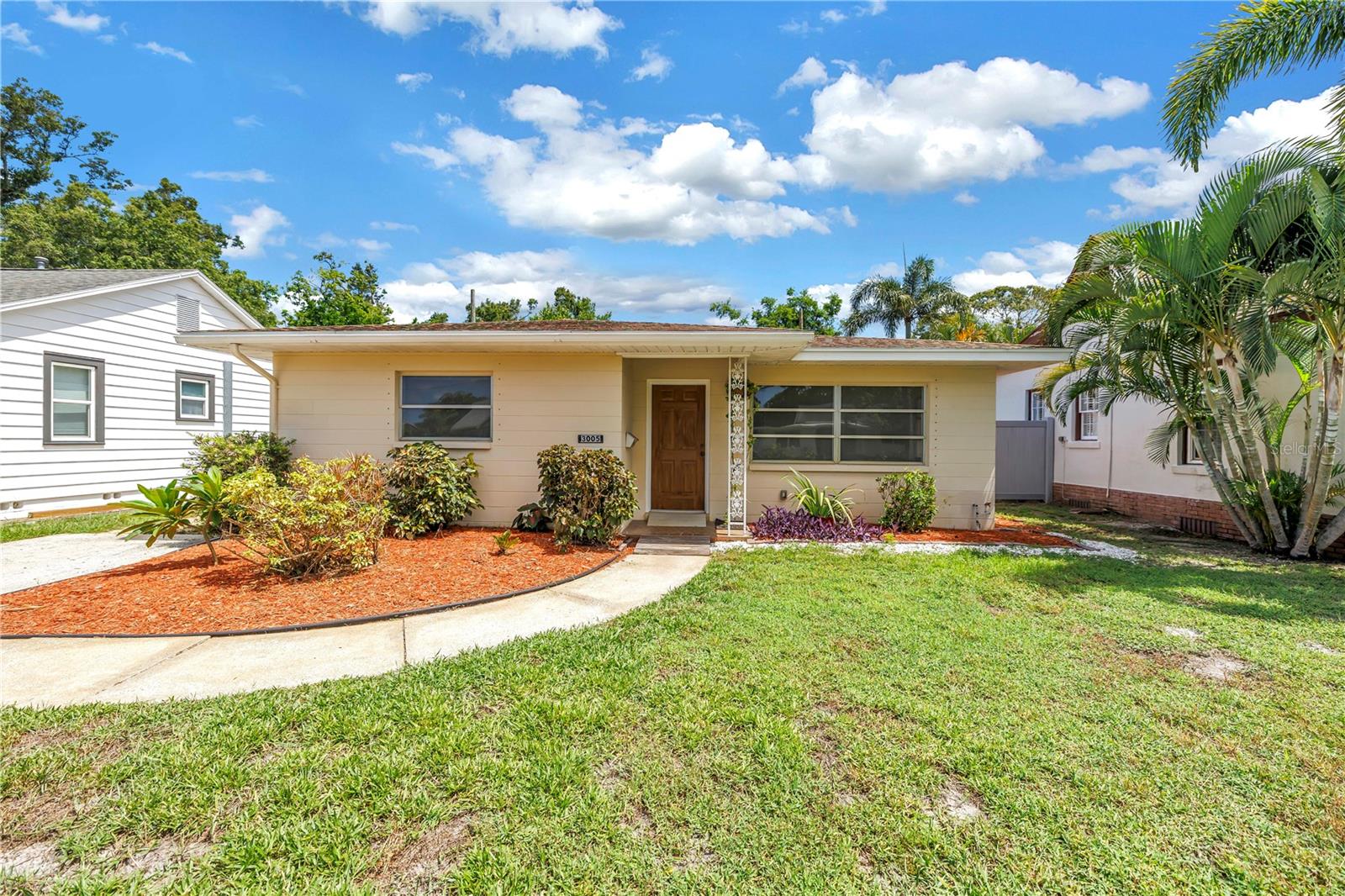 Welcome to this charming mid-century home located in the heart of the North Kenwood neighborhood of St. Petersburg. Built in 1960, this 2-bedroom, 1-bath residence offers 1,228 square feet of living space and has been lovingly maintained to preserve its original character. Inside, you’ll find beautiful terrazzo floors, a kitchen full of vintage charm with built-in bookshelves, and a bathroom that retains its classic 1960s details. Both bedrooms are generously sized, featuring oversized closets, and one includes a built-in dresser for added convenience. The home also includes a detached two-car garage with an automatic door opener and washer/dryer hookups. The irrigation system runs on a well, helping to keep water bills low. Move-in ready and full of character, this home is a perfect blend of vintage appeal and modern comfort in one of St. Pete’s most desirable neighborhoods.