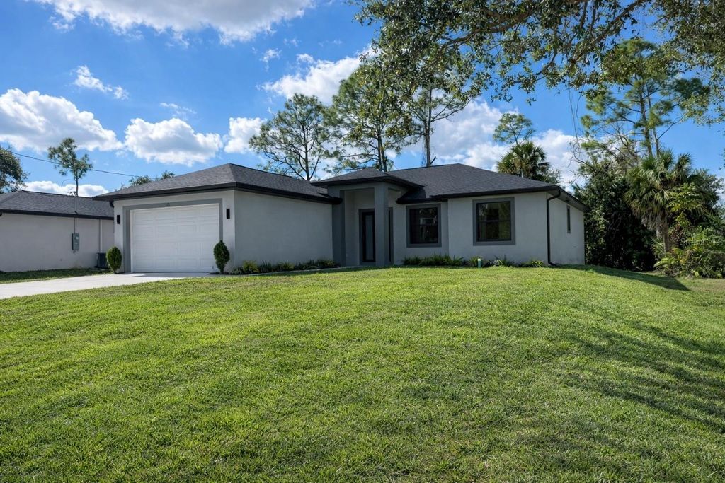 Photo of 73 Flamingo Boulevard, Port Charlotte, FL 33954 (MLS # TB8404539)