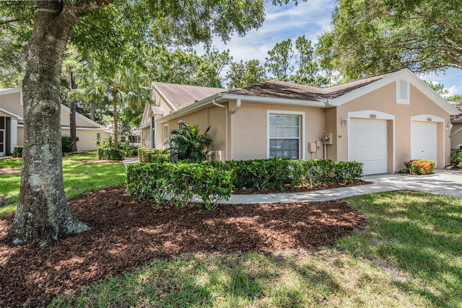 One or more photo(s) has been virtually staged. Honey Stop the Car! Don't Miss Out on this Updated 3 Bedroom, 2 Bath, 1 Car Garage End Unit Villa in Coventry Village. Not in a Flood Zone but only a short drive to the water and beaches! This Open floor plan is a perfect blend of comfort, convenience and Florida Charm with high Vaulted Ceilings and split bedrooms providing privacy. Featuring Freshly Painted Interior, New Wood-like flooring, New appliances and plenty of living space with a Great Room and Dining Room for entertaining. The high ceilings and large sliding glass doors flood the space with lots of natural light, creating a warm and inviting atmosphere. The Large kitchen features New Stainless Steel Appliances, plenty of Counter space, Island, breakfast bar & large breakfast Nook. Showcasing a Large Master suite with sliders to Patio, 2 walk-in closets & en suite Bathroom with Garden tub & step-in shower. 2 Bedrooms at the front of the home share an adjacent Bath with Tub/shower. Inside Laundry closet with washer & dryer for convenience. Step outside to your private Lanai & tranquil Pond Views. This is the perfect area to relax in the sun with your morning coffee or host barbecues and gatherings with friends and family. Water Heater 2024. HOA is $498 a month and includes Community Pool, Ground Maintenance, Cable, Internet & Trash. Super location, close to shopping, Publix, Restaurants, Medical facilities, Two Airports, County Parks, and not far to the beaches. Enjoy everything this Villa has to offer.